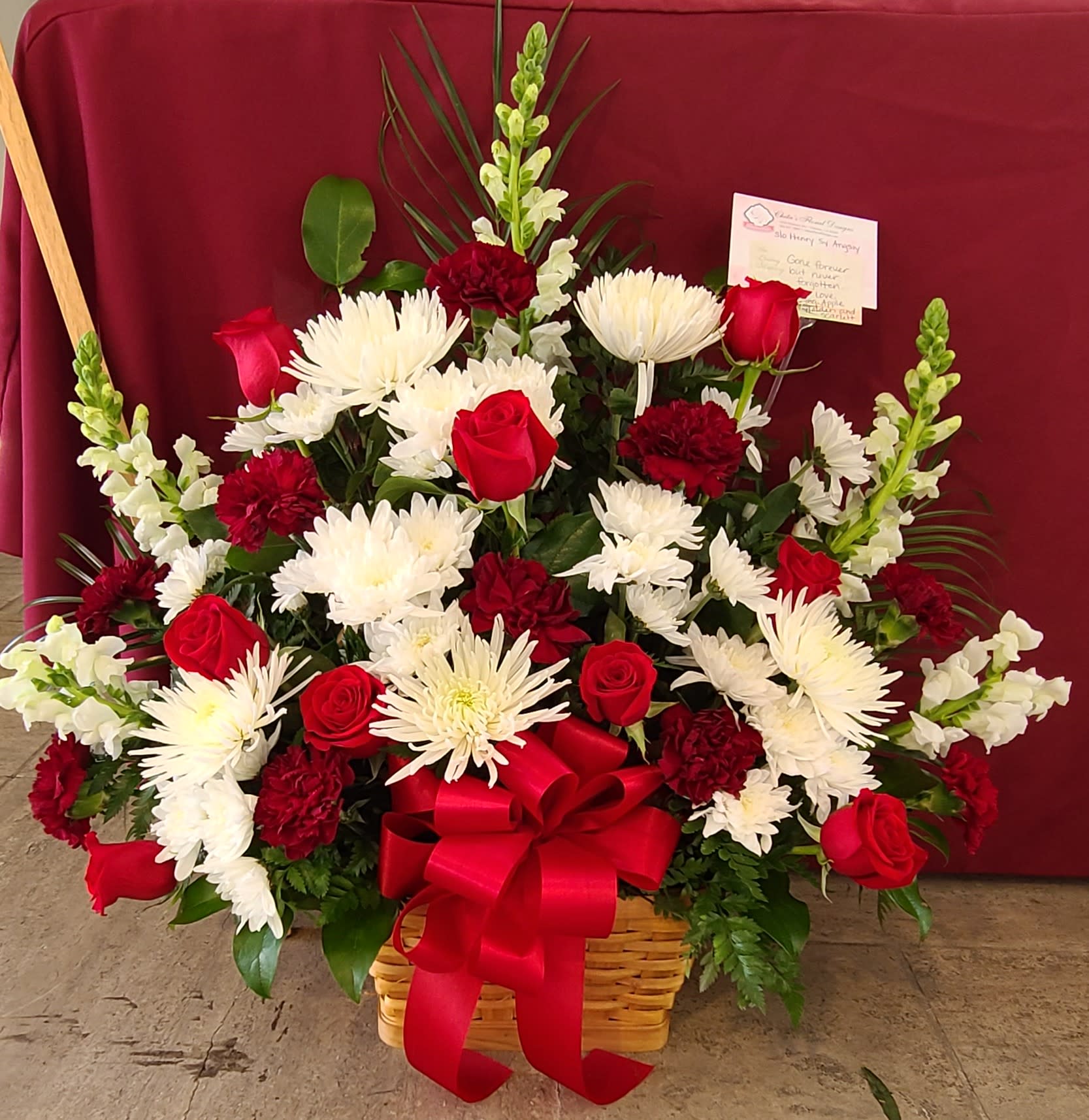 Deeply Loved Basket Deeply Loved Basket - Red roses and carnation with white flowers in a wicker basket.