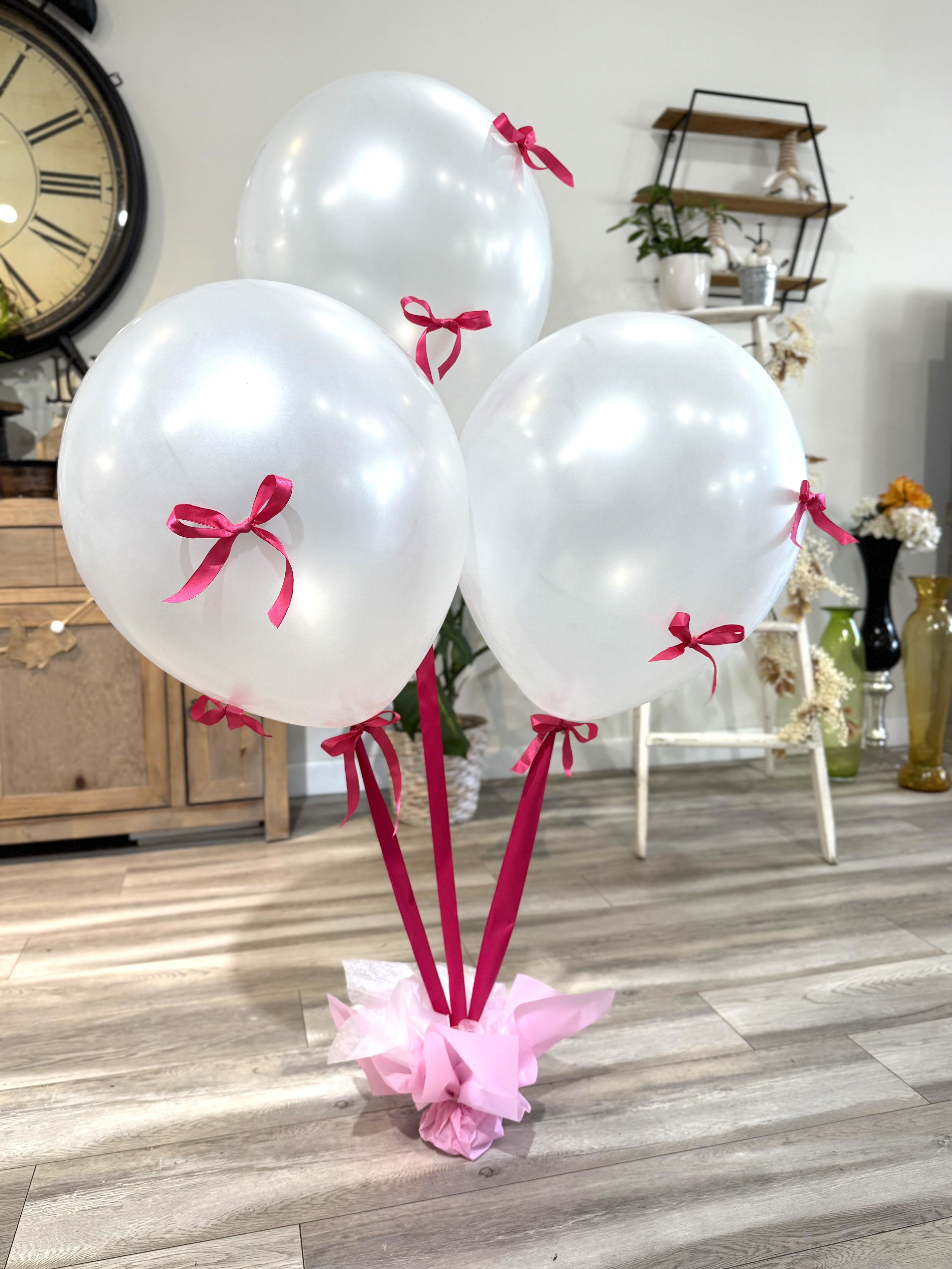 LF 410 Large Fancy Balloon Bouquet - This large fancy balloon bouquet is sure to &quot;Wow&quot; that special someone. They are large 18&quot; pearl balloons with satin ribbon and satin bows. You can order THREE  or FIVE balloons and pick a ribbon color of hot pink, light pink and red. Perfect to add to a flower bouquet or teddy bear, it will surely be impressive!