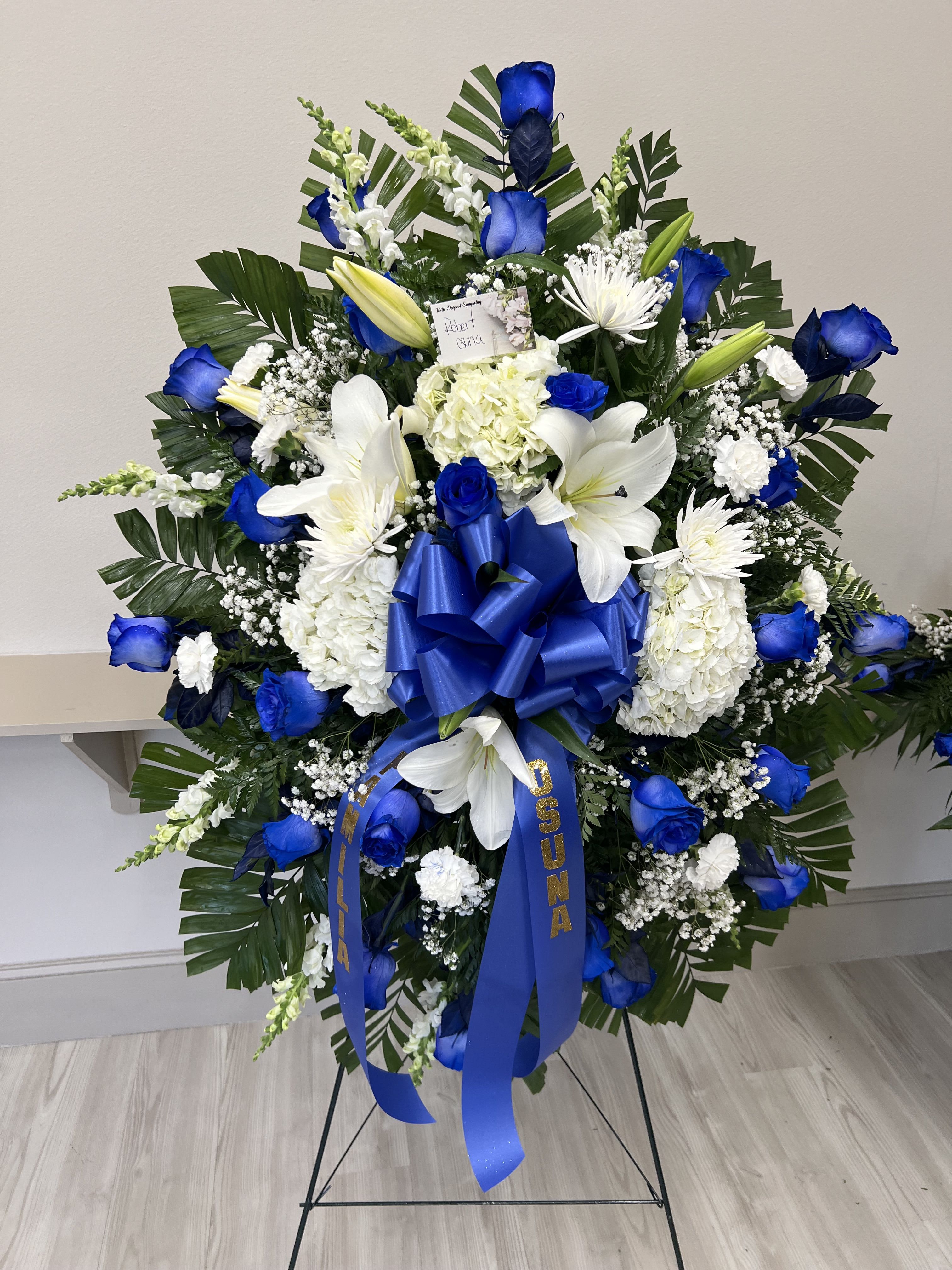 Blue &amp; white stand spray  - 25 roses - lilys - hydrangeas- white cushion 