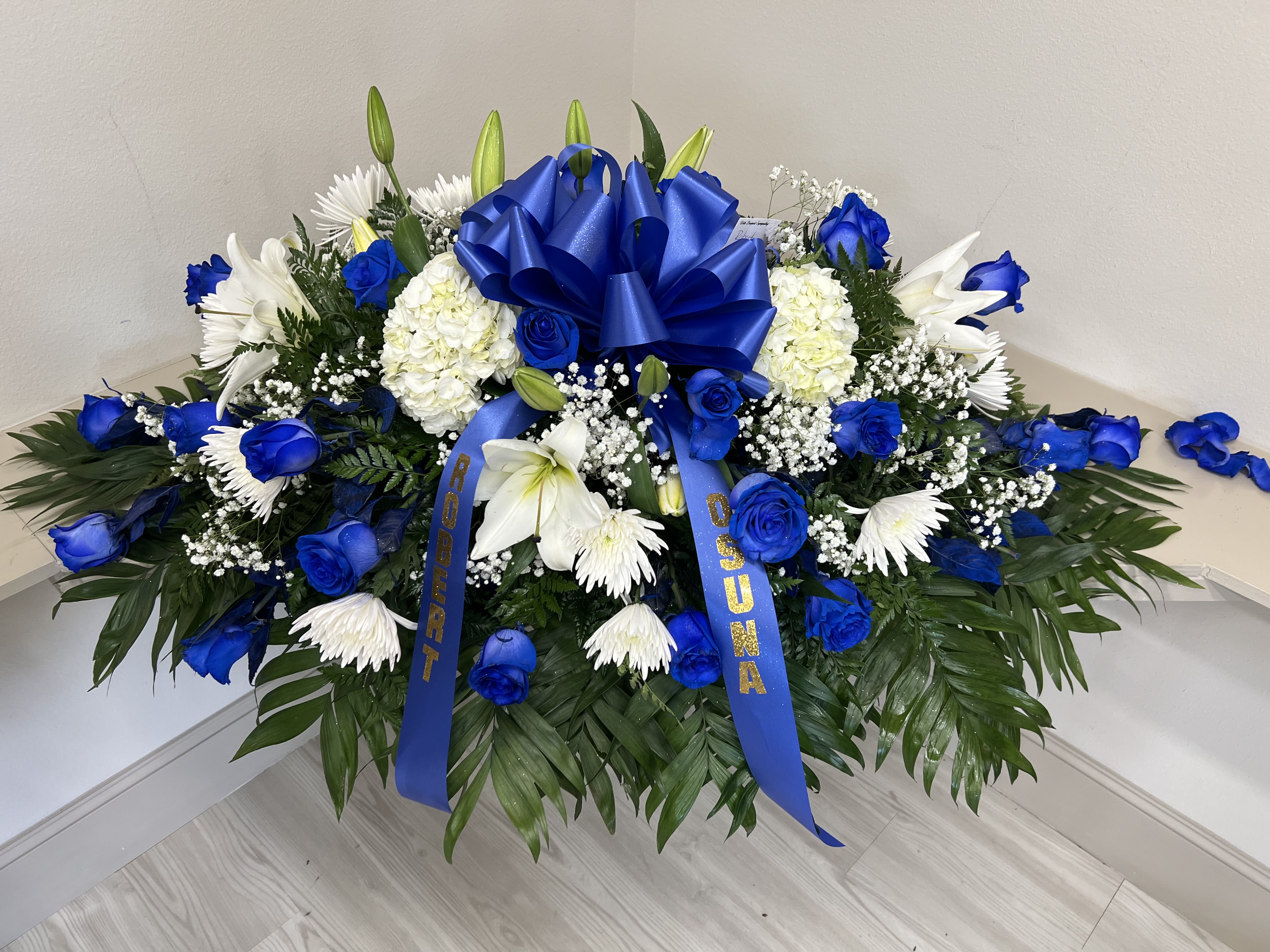 Blue &amp; white casket  - 25 roses + mix flowers 
