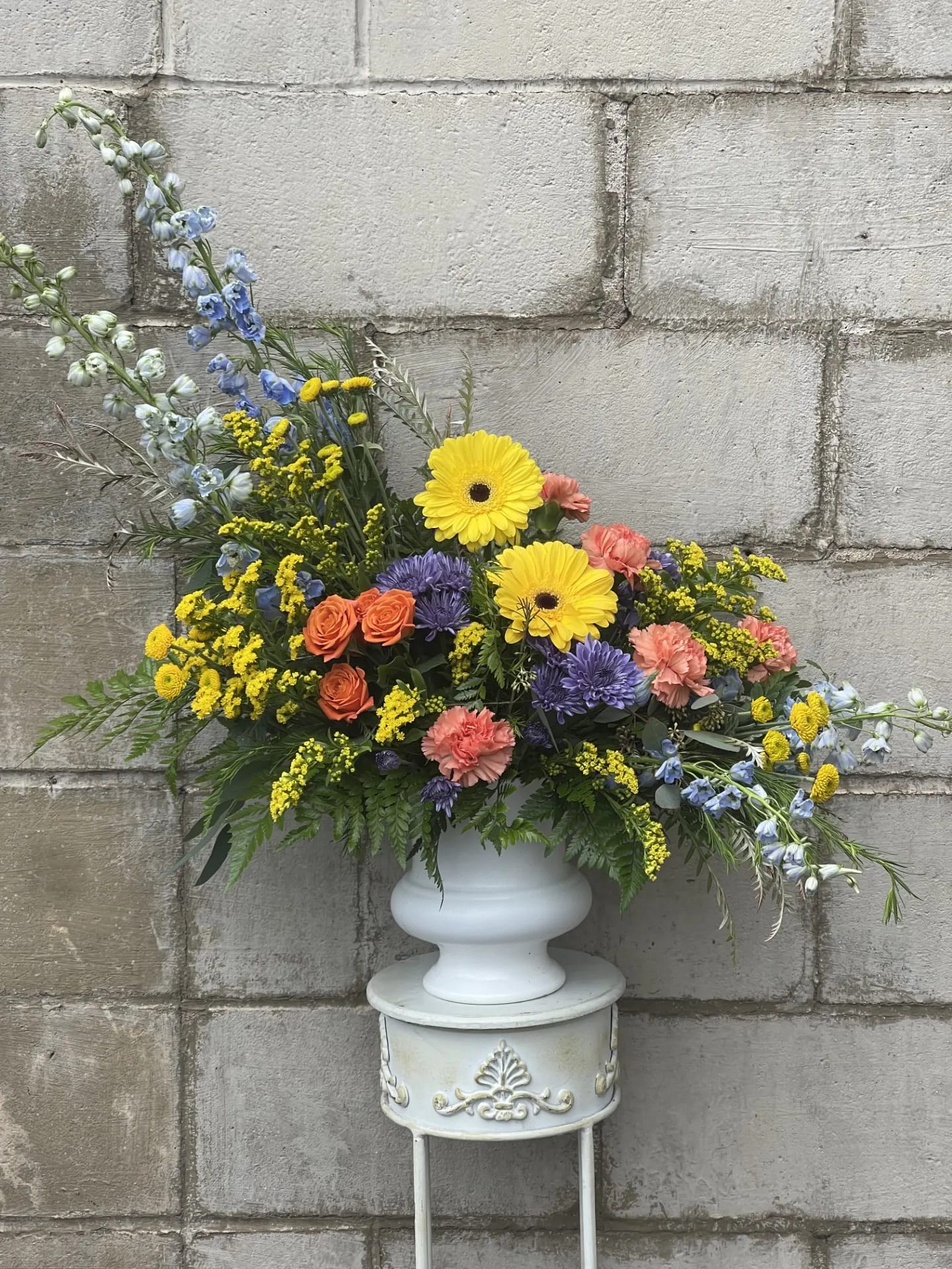 A Beautiful Life  - A show stopping arrangement filled with a variety of brightly colored blooms. This is a designers choice arrangement meaning all flowers and colors will change. The vase will remain the same, but the vase color may also change due to availability. 