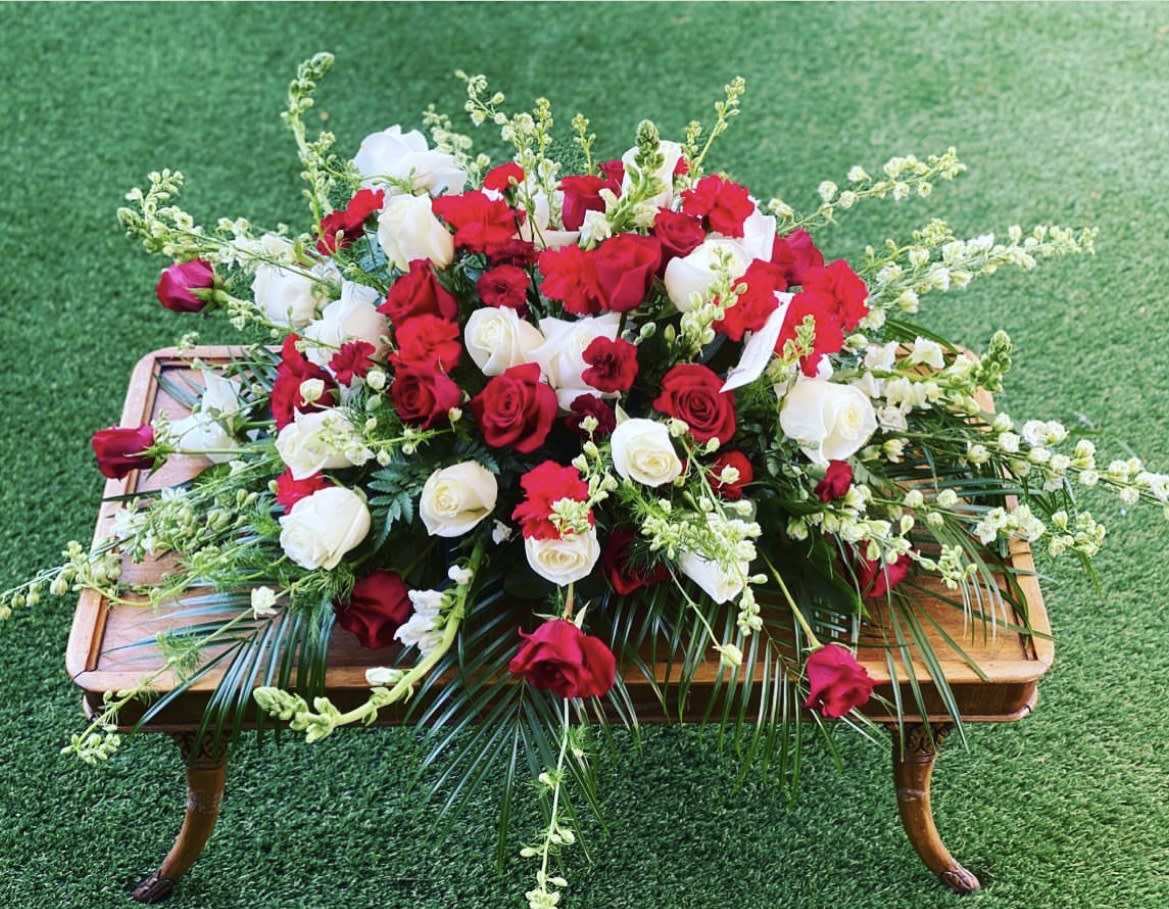 Caskets Spray - Funeral Design  - At this difficult time, our custom-made funeral designs are tailored to honor your loved one uniquely. Kindly share your color preferences and any details in the florist comments. If you're uncertain or have questions, feel free to call us at 602-675-3110 or text at 602-319-0104. We're here to guide and assist you through the process. Check our samples of our work in the attached pictures.
