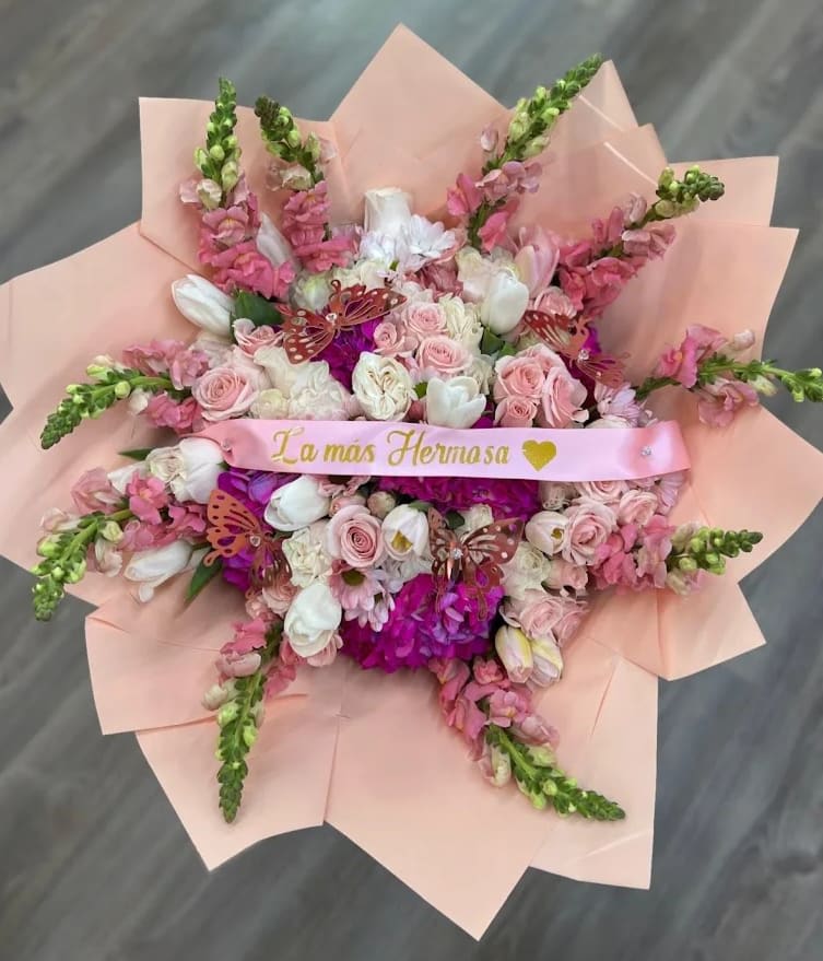 Mixed flower bouquet - Mixed flower bouquet wrapped in paper. Includes variety of flowers like Roses, Hydrangeas, Lilies, Carnations, Tulips, and other filler flowers. Pink and White themed.  Ribbon with letters not included***
