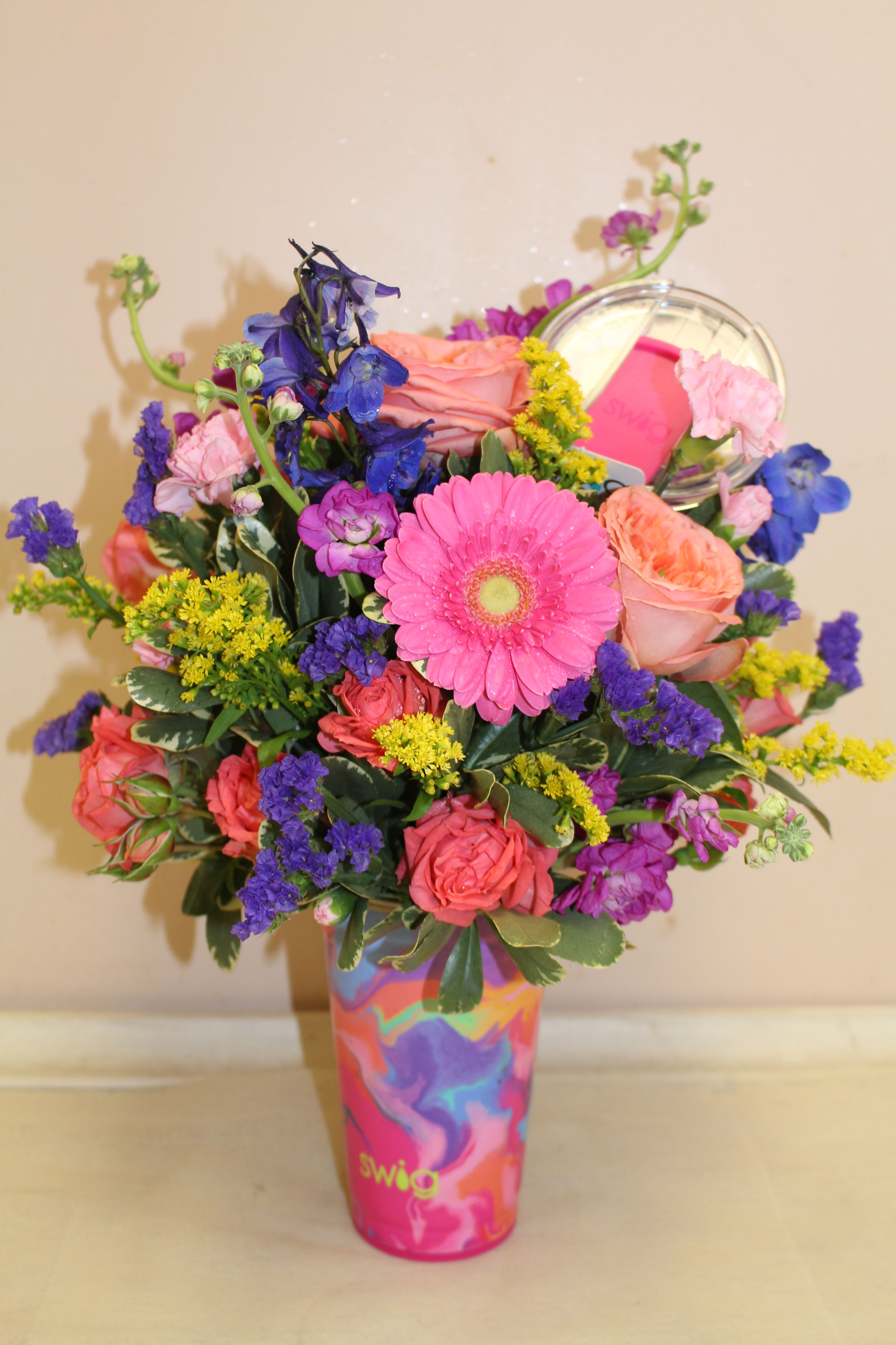swig Candy Crush Party Cup 24oz - Flowers and a tumbler!!! Party-Ready!  Take a bite out of the rainbow with these bright swirls of hot pink, lime and blue.    Party hard (and more sustainably) with our stackable 24oz Insulated Party Cups. Take bigger sips with our new EZ Slider Lid featuring a larger opening for faster flow and an updated removable slider design that is easy to clean and reassemble! Holds up to 24oz Keeps drinks cold 12+ hours and hot 3+ hours Measures: 6.7&quot; H x 3.9&quot; W (lid included) Base: 2.8&quot; in diameter Weighs: 0.8lb when empty