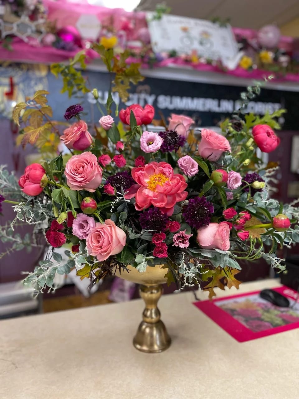 Charmed Kisses Charmed Kisses - This arrangement will "Charm" everyone... you will be sure to get kisses! -shown an actual size "Deluxe" -different colors are available Seasonal/not available flowers can be replaced with a similar one