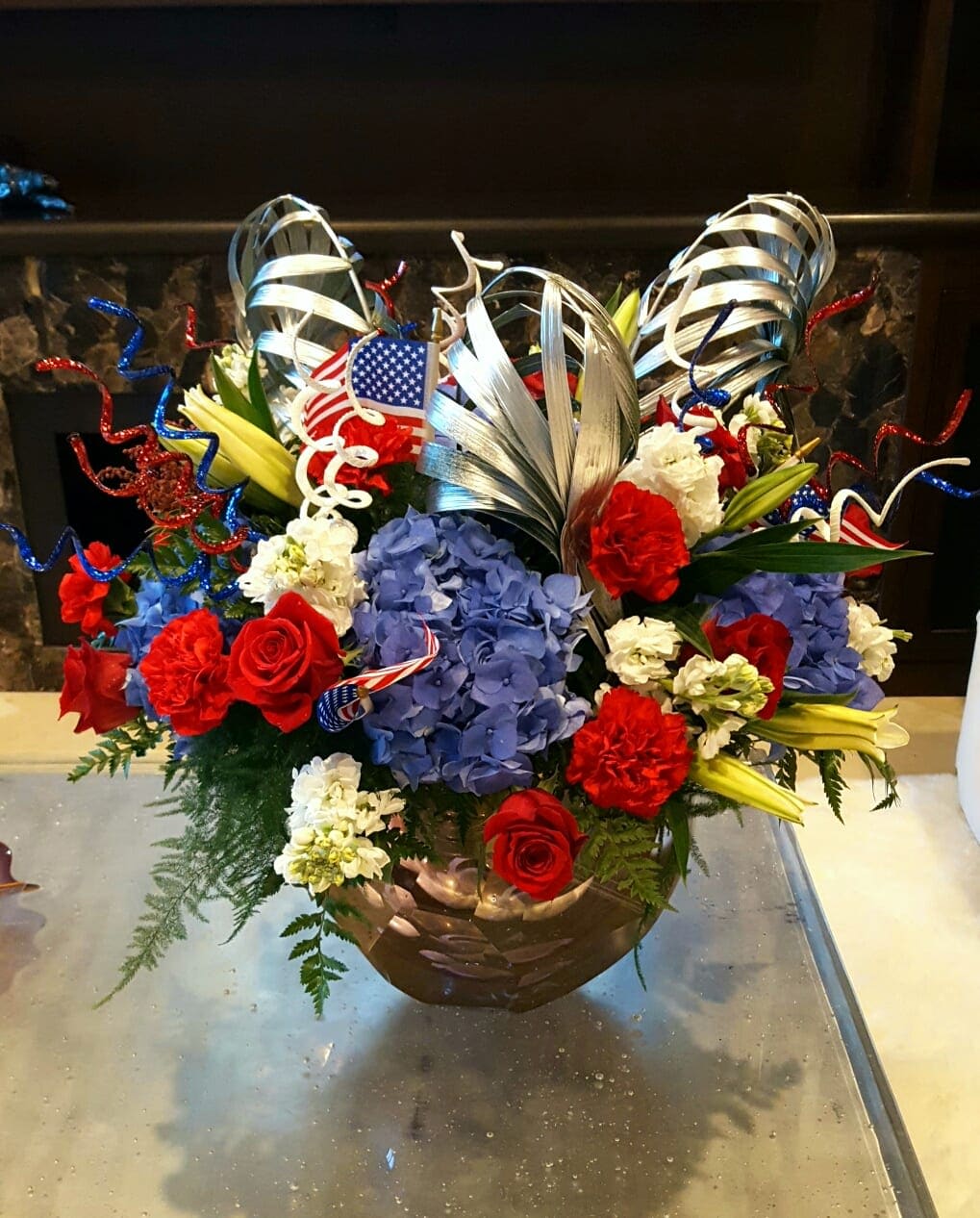 Flower-works Flower-works - No better way to say "Happy Birthday, America," than with this patriotic variety of red, whites and blues.