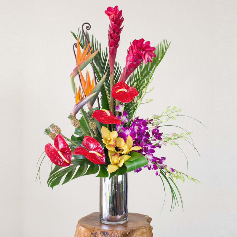 Island Opulence Island Opulence - This contemporary design contains an array of Hawaiian beauties with a cascading fall of orchids. Bring the Islands home with you with this stunning work of art.