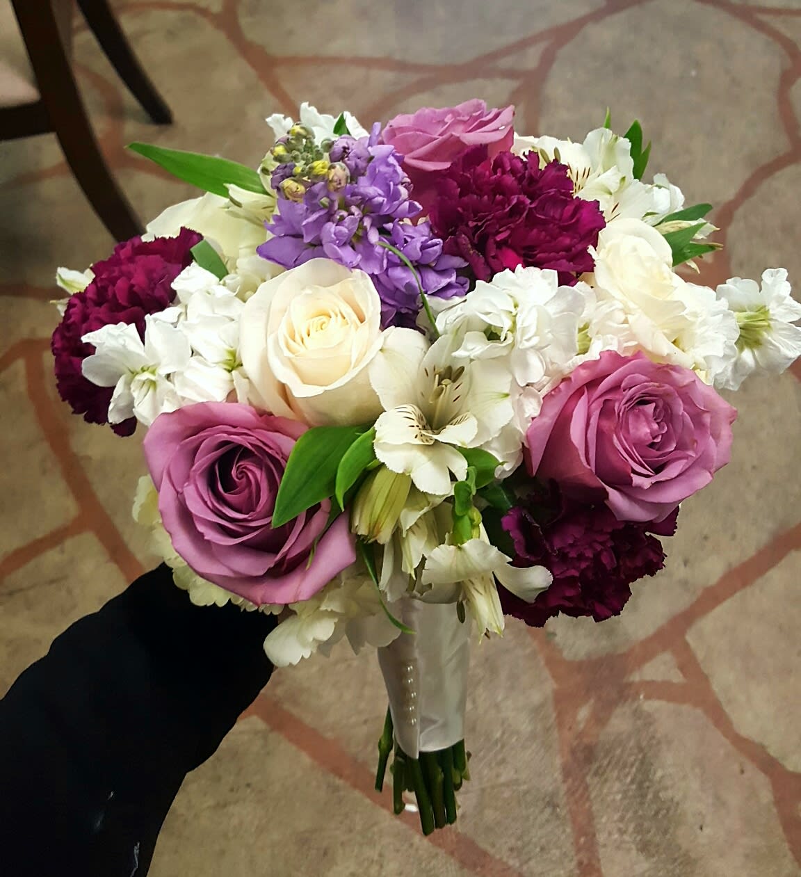 MODERN JEWEL BOUQUET MODERN JEWEL BOUQUET - A HANDWRAPPED BRIDAL BOUQUET WITH BILLOWY WHITE HYDRANGEA,HINTS OF LAVENDER, AND SPLASHES OF BURGUNDY.