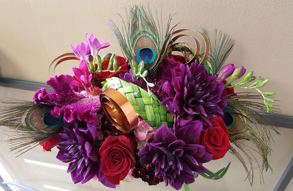 Plum Peacock Plum Peacock - Proudly presenting our unique Valentine's Day PlumFeathers arrangement.