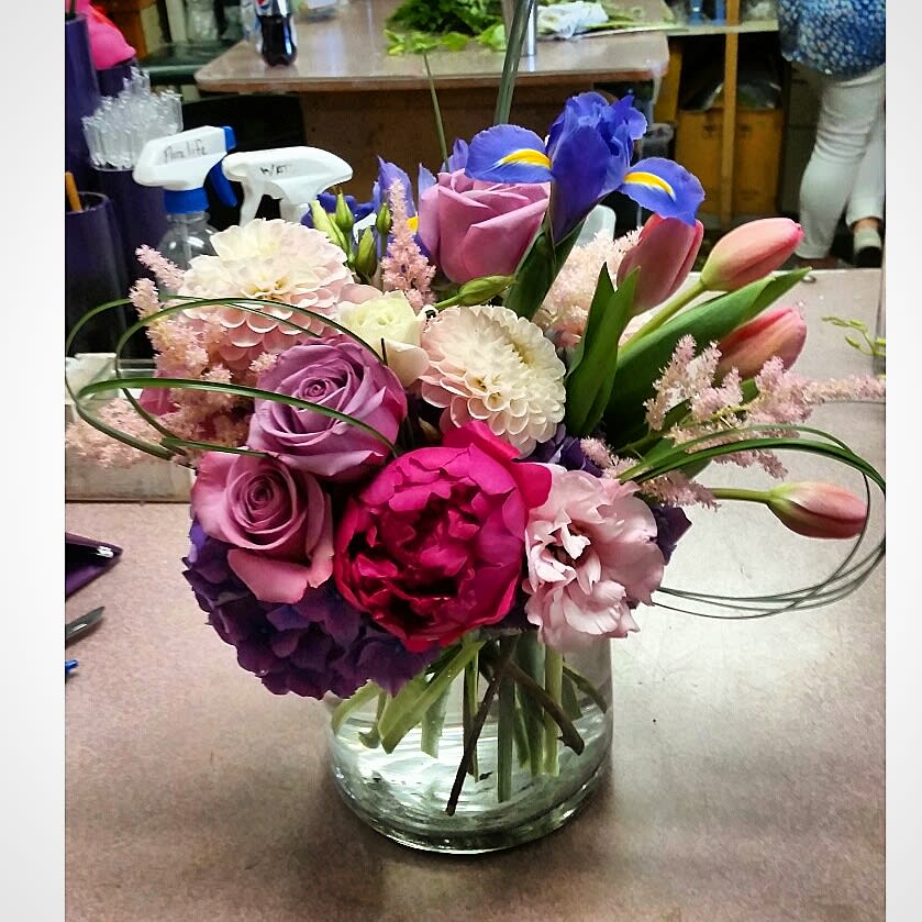 Pop of Purple Pop of Purple - The pastel colored roses, dahlias, tulips, and mix of other flowers against the "pop of purple" in the iris and hydrangea, and the burst of hot pink in the peonies, gives a great contrast of color to draw in your eye... and your heart!