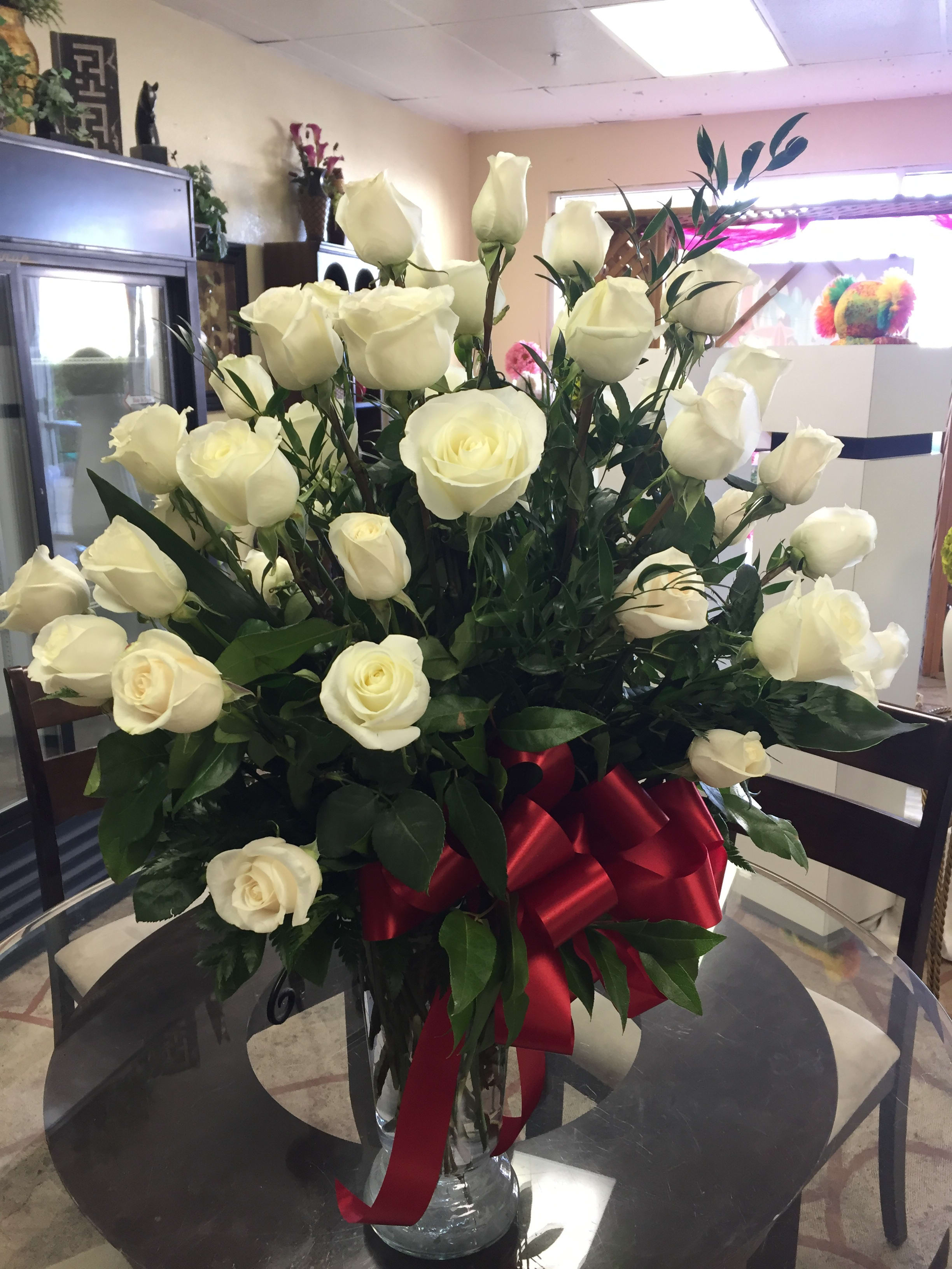 Pure  Love  - 50 beautiful white roses from Sun City Summerlin Flowers - serving the Las Vegas community and sharing joy and happiness. 