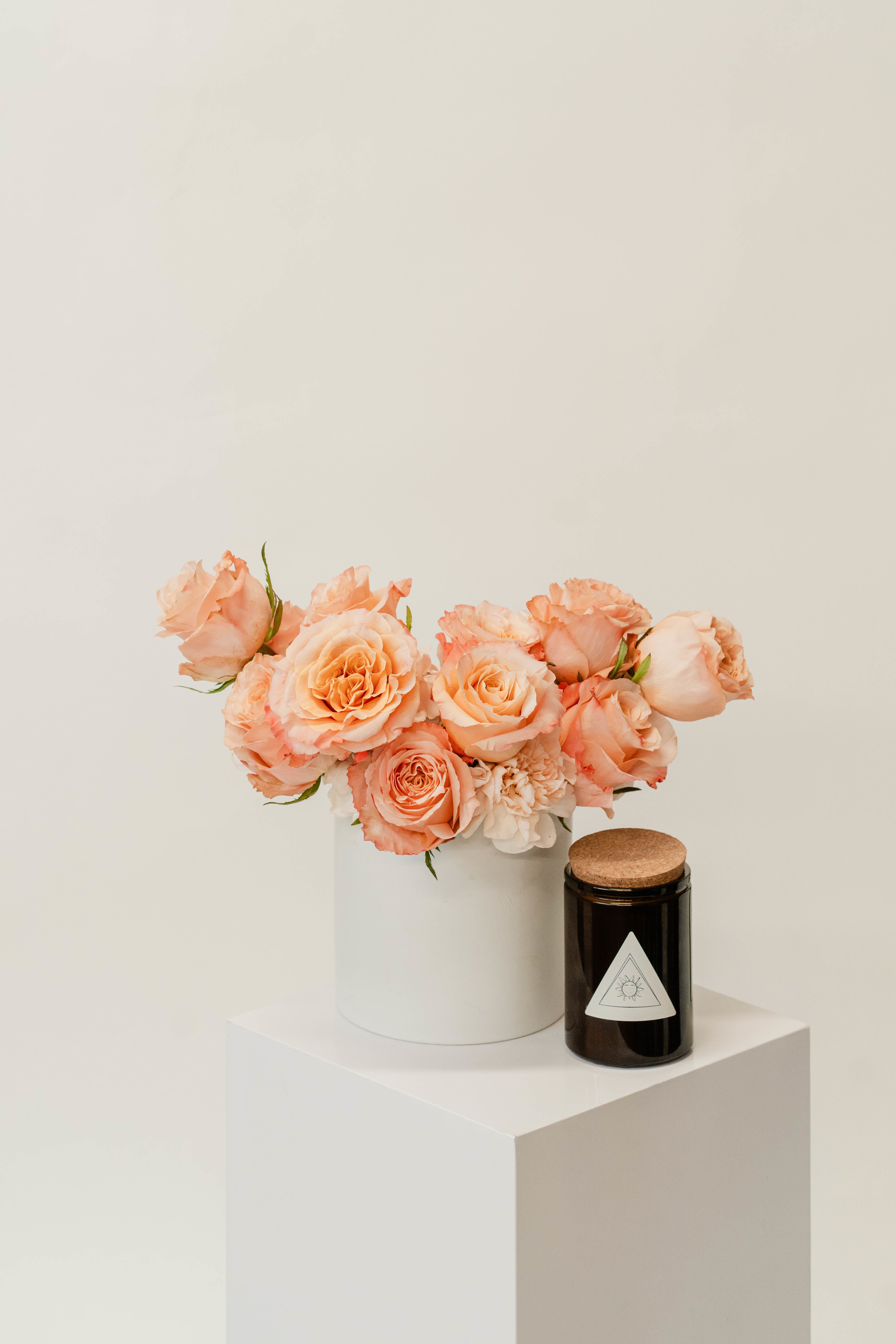 Dozen Roses + Candle Bundle - Our timeless rose and candle bundle features one dozen premium roses paired with a handcrafted candle, creating a perfect harmony of elegance and warmth. Ideal for romantic gestures and sophisticated gifting, this bundle is designed to captivate and delight with its classic beauty and inviting ambiance.   