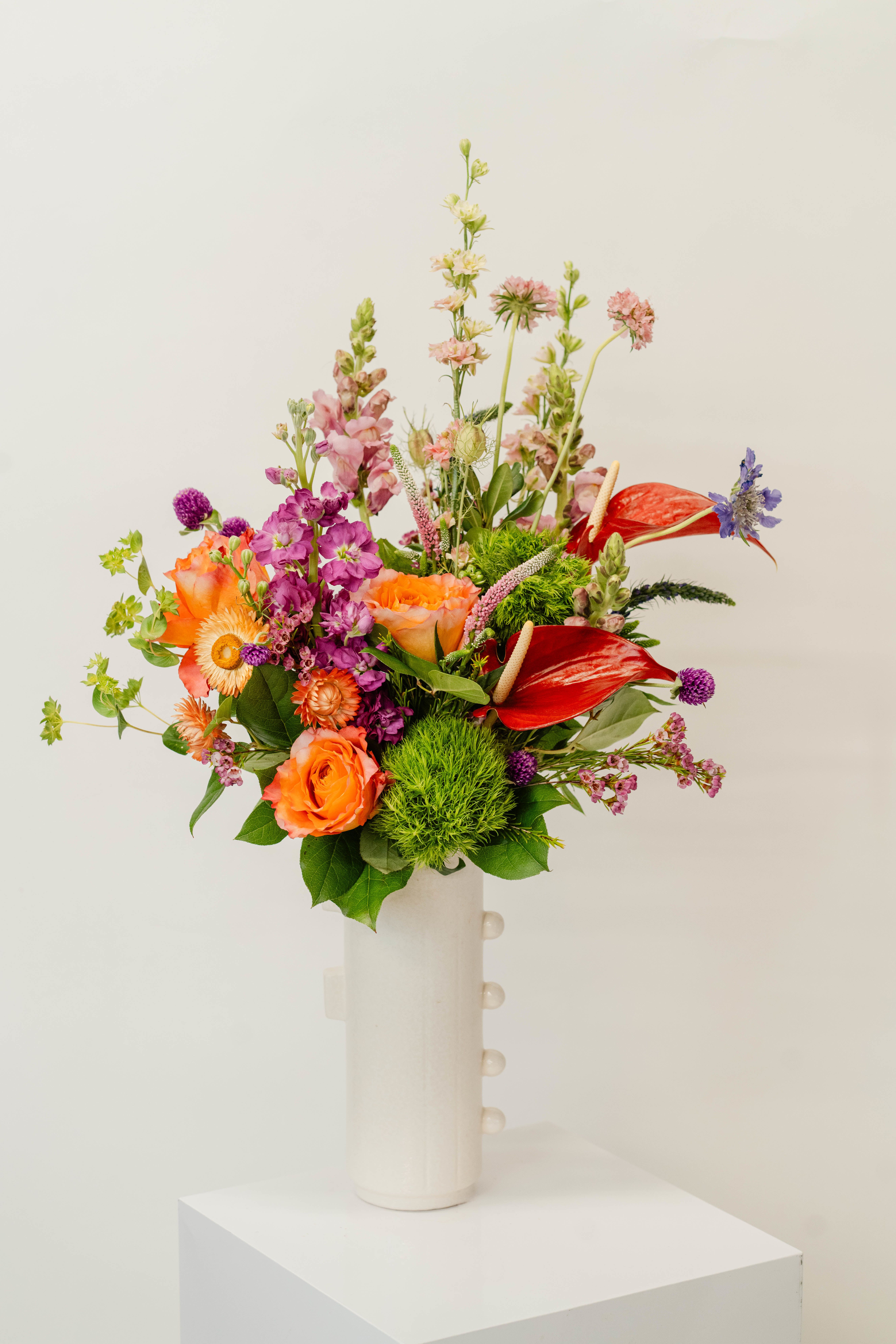 Deluxe Vase Design - Our in-house professionals will combine the best-looking florals and color schemes for a stunning arrangement.  *Please feel free to leave us some direction in the &quot;comments/notes&quot; section during check-out (such as favorite colors, types of flowers, style, etc.).  *Images depict designer-choice arrangements at various price points and are representative in nature. Your arrangement will be of equivalent quality but may feature different flowers depending on your budget and availability.   