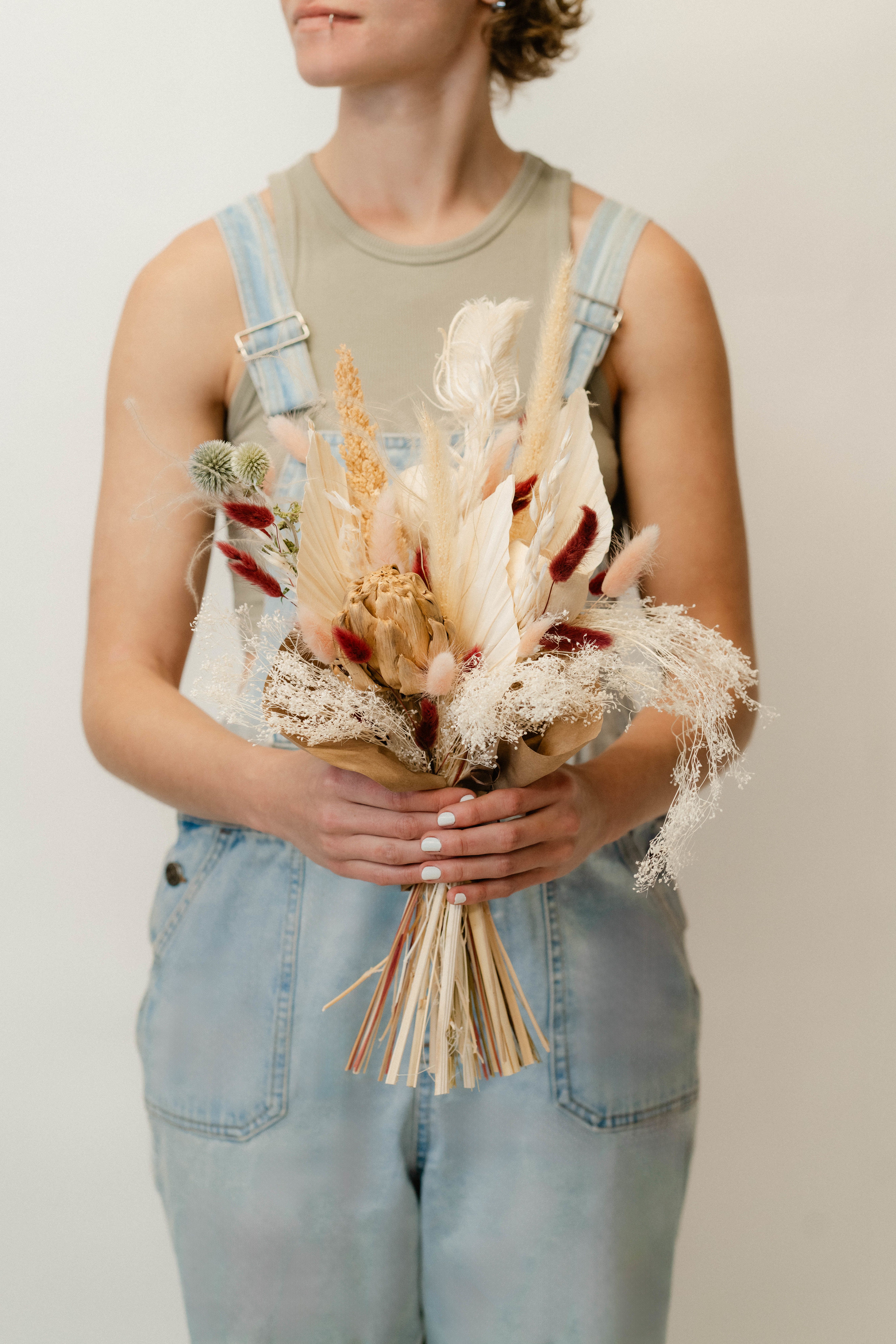 Large Dried Hand-tied Bouquet - Our large dried hand-tied bouquet is a striking arrangement of preserved blooms and textural elements, designed to bring lasting beauty and sophistication to any space. Bold and impactful, it’s the perfect centerpiece or gift for those who appreciate timeless, natural elegance.    