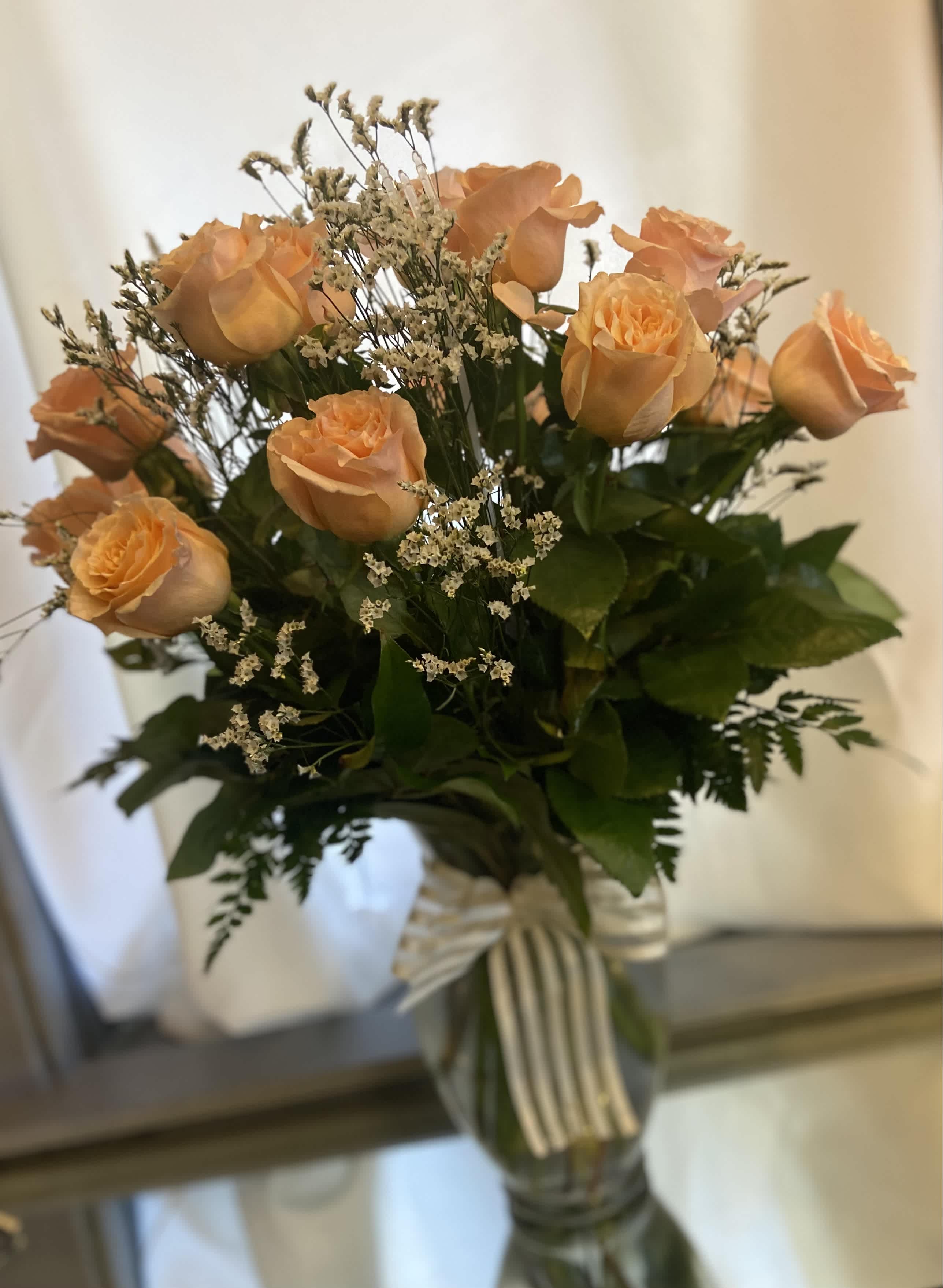 12 peach shimmer roses with luscious greens and white misty limonium designed in a beautiful glass vase with soft elegant ribbon  - Peach shimmer roses with greens and white misty 