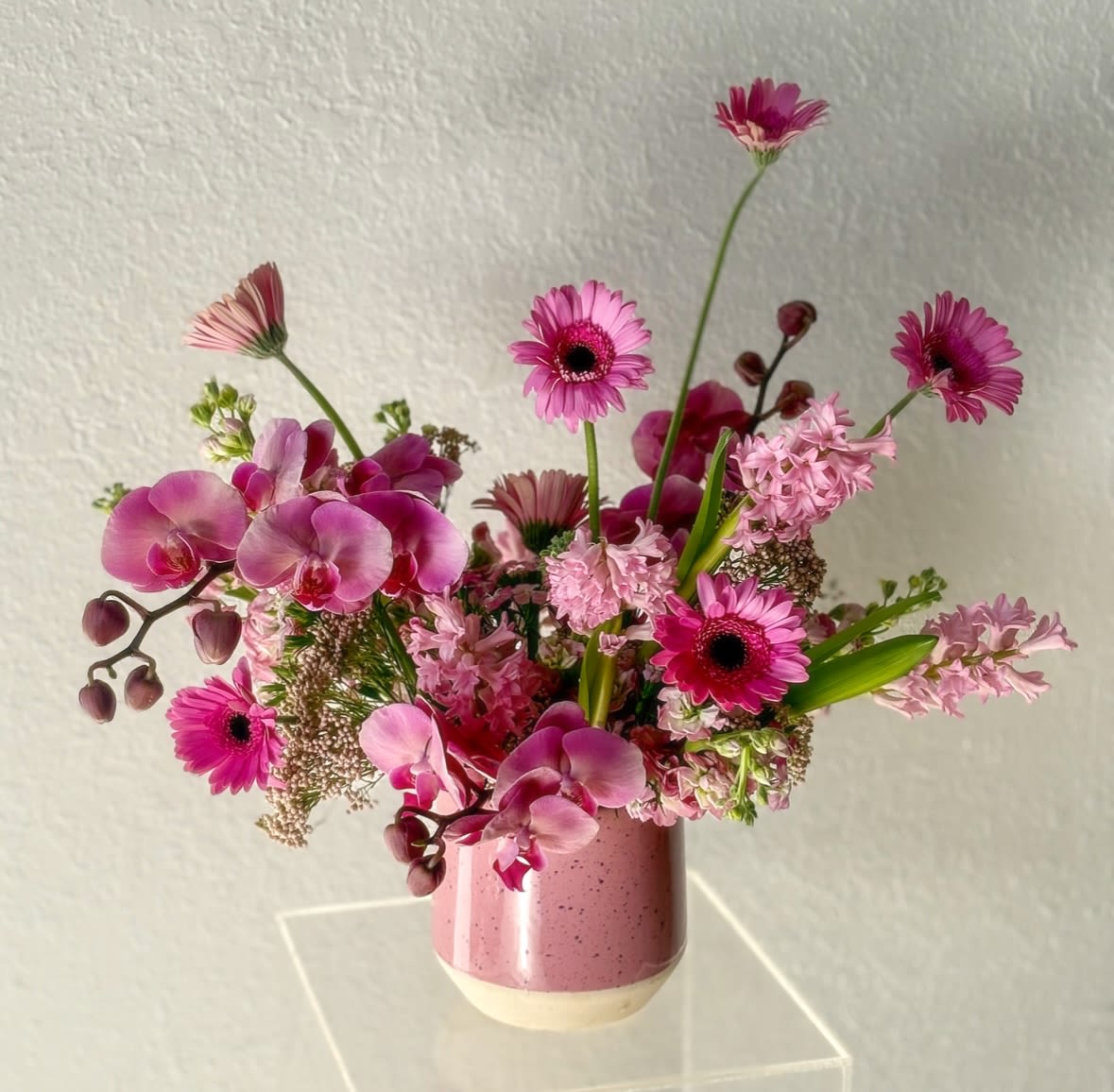 Pretty in Pink Pretty in Pink - "Pretty in Pink" is a bold and vibrant floral arrangement that commands attention with its striking pink hues and lively energy. Full of passion and personality, this arrangement brings a burst of color and excitement to any occasion. Its dynamic composition radiates confidence and modern elegance, making it the perfect choice for celebrating love, triumph, or simply adding a pop of bold beauty to your space. "Pretty in Pink" is a statement piece that leaves a lasting impression with its daring, spirited charm.