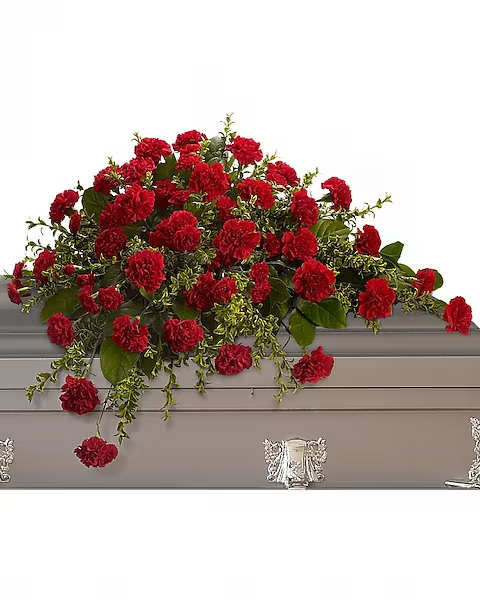 Adoration Casket Spray - This classic half-couch spray of brilliant red carnations makes a striking and dignified statement. Radiant red carnations and miniature carnations accented by fresh greenery arrive in a lovely spray.