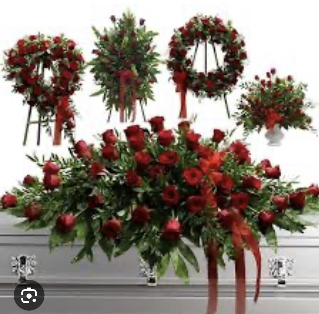 Valley  Of Roses  - A stunning array that clearly  communicates a deep love . A room full of red roses . This a a set that comes with a casket spray half or full , a standing spray  or a heart wreath and a pedestal basket . A beautiful tribute  of love.
