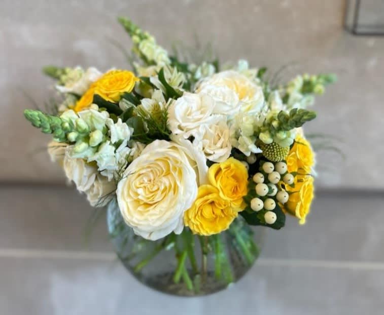 Yellow Delights  - This amazing arrangement is the perfect mixture of textures, colors and style.  Your recipient will be delighted by the smells of fresh roses and snapdragons.  This arrangement can be sent for many occasions.  