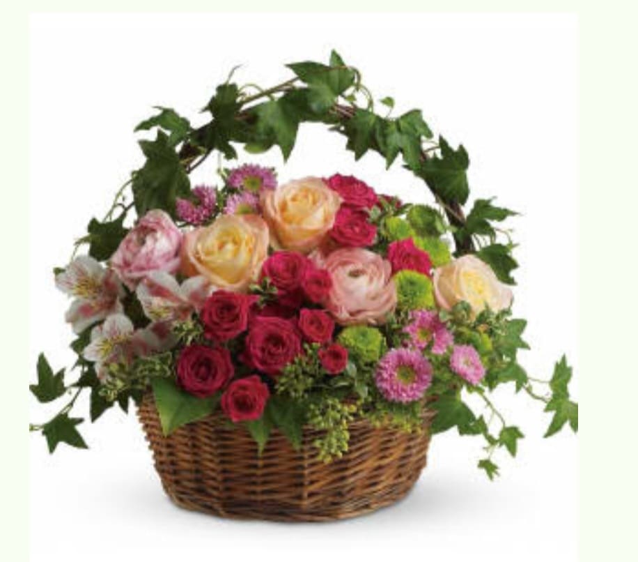 Fairest of All  - Light roses, hot pink roses and gorgeous pink alstromeria and more are delivered in a charming ivy handled woven basket. The perfect arrangement for any occasion to show you care.