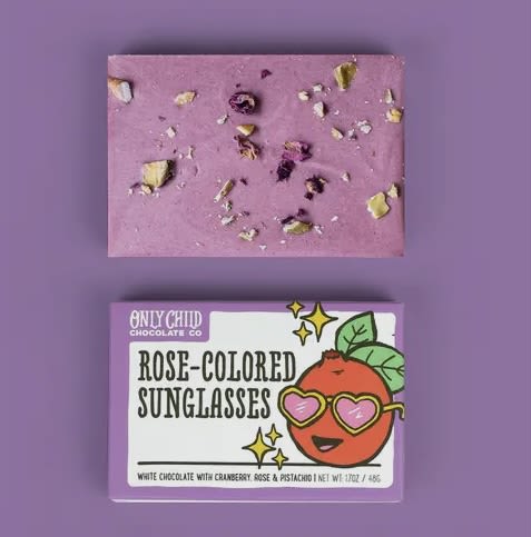 Rose Colored Sunglasses - Cranberry Rose Pistachio Chocolate Bar Rose Colored Sunglasses - Cranberry Rose Pistachio Chocolate Bar - A perfect treat for when you need a little optimism in your life. Our rose-colored sunglasses bar is made from an Ecuadorian white chocolate ground for 24 hours with cranberries and kissed with rose oil. We then finish off the party with rose petals and slow roasted pistachios. Sweet, tart, and floral with just a bit of nuttiness, just like us!