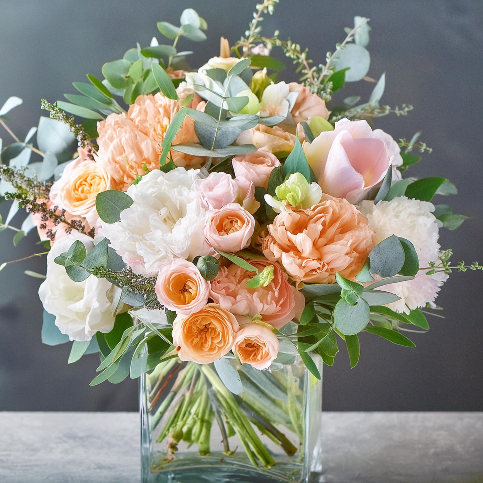 Southern Elegance Bouquet Southern Elegance Bouquet - Introducing the Southern Elegance Bouquet by Life That Blooms, a stunning arrangement perfect for any occasion. This luxurious bouquet features a harmonious blend of peach and white roses, delicate calla lilies, and lush green eucalyptus leaves. Each flower is meticulously arranged in a clear vase to create an elegant and timeless centerpiece. Whether it's for a special event or everyday beauty, this bouquet is sure to bring a touch of sophistication to your space. Available exclusively in Charlotte, handcrafted with love for your memorable moments.