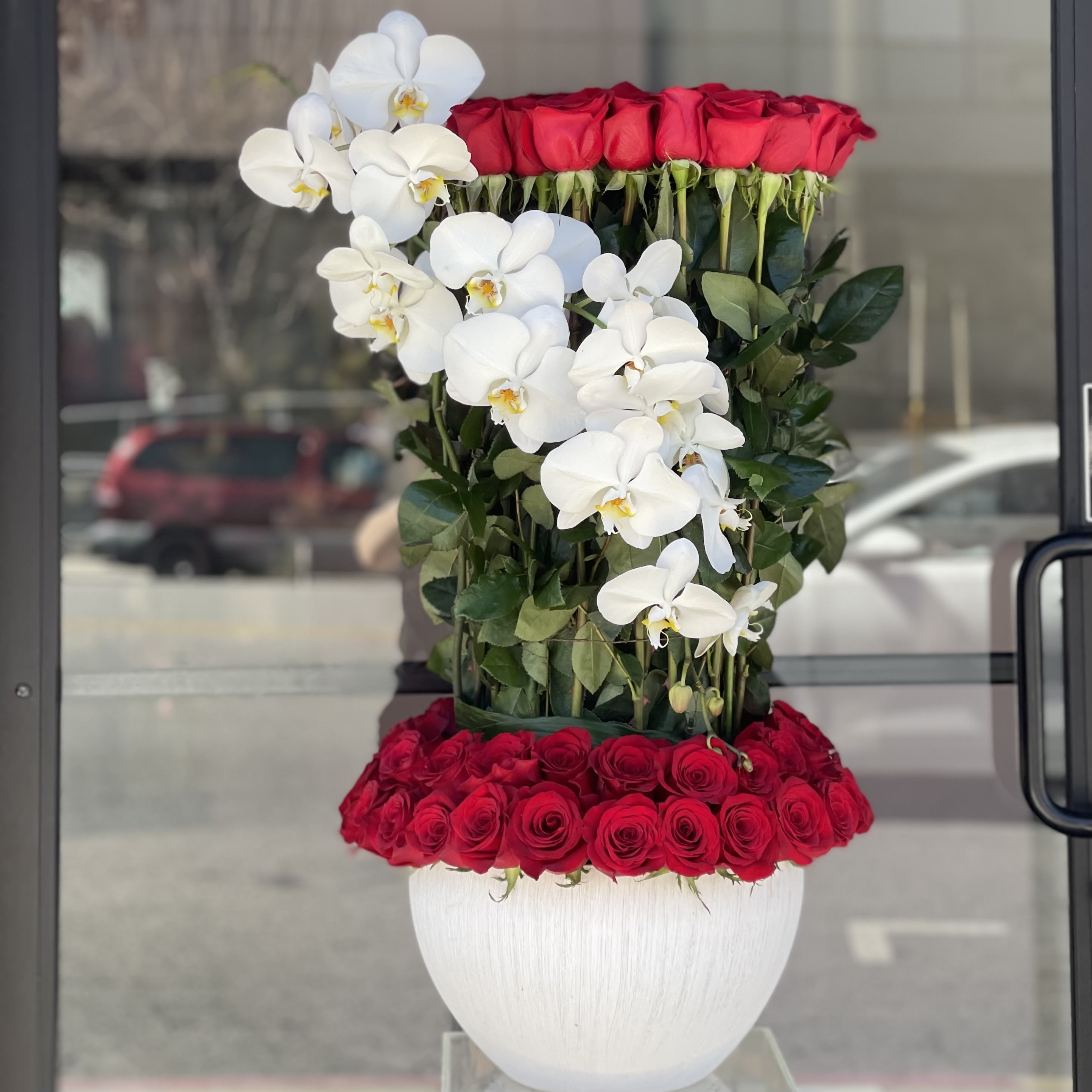 Tower of Beauty V - 100 Fresh Roses and Orchids in a vase.   If we not gonna have exactly same vase, we will replace it with the same style vase