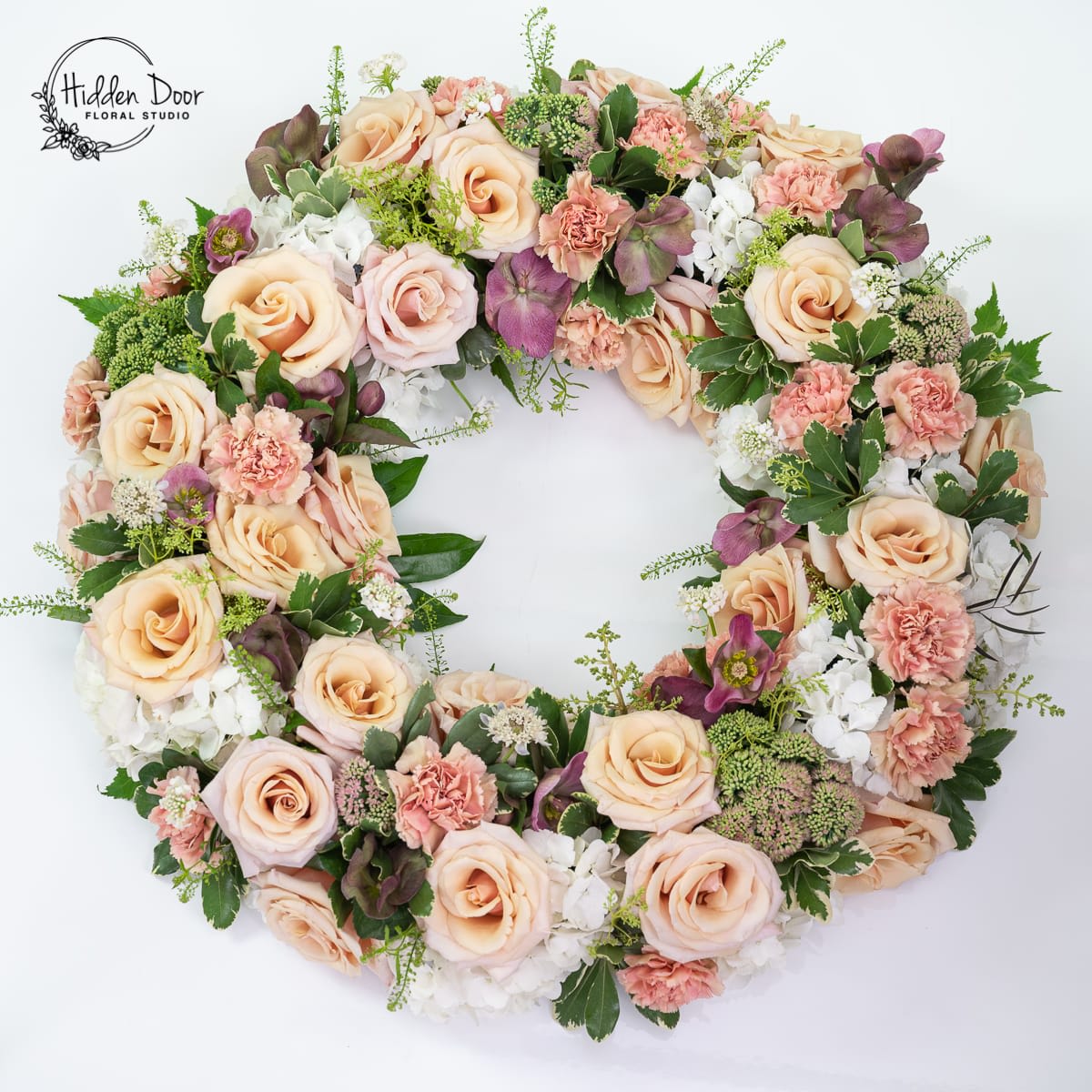Wreaths-Blush - If you need to order funeral flowers for service in Raleigh, NC, Hidden Door Floral Studio offers delivery and a variety of flower arrangements for funerals to choose from. 