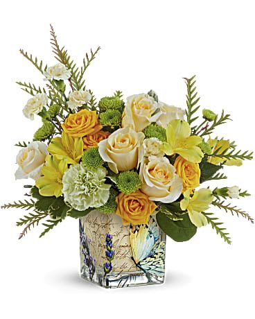 Teleflora's Send Sunshine Bouquet Teleflora's Send Sunshine Bouquet - Send a sweet ray of sunshine someone's way with this cheerful yellow bouquet, artfully arranged in a vintage-inspired glass cube. Yellow spray roses, yellow alstroemeria, green carnations, miniature yellow carnations and green button spray chrysanthemums are arranged with grevillea and variegated pittosporum. Delivered in Teleflora's Vintage Butterfly Cube.