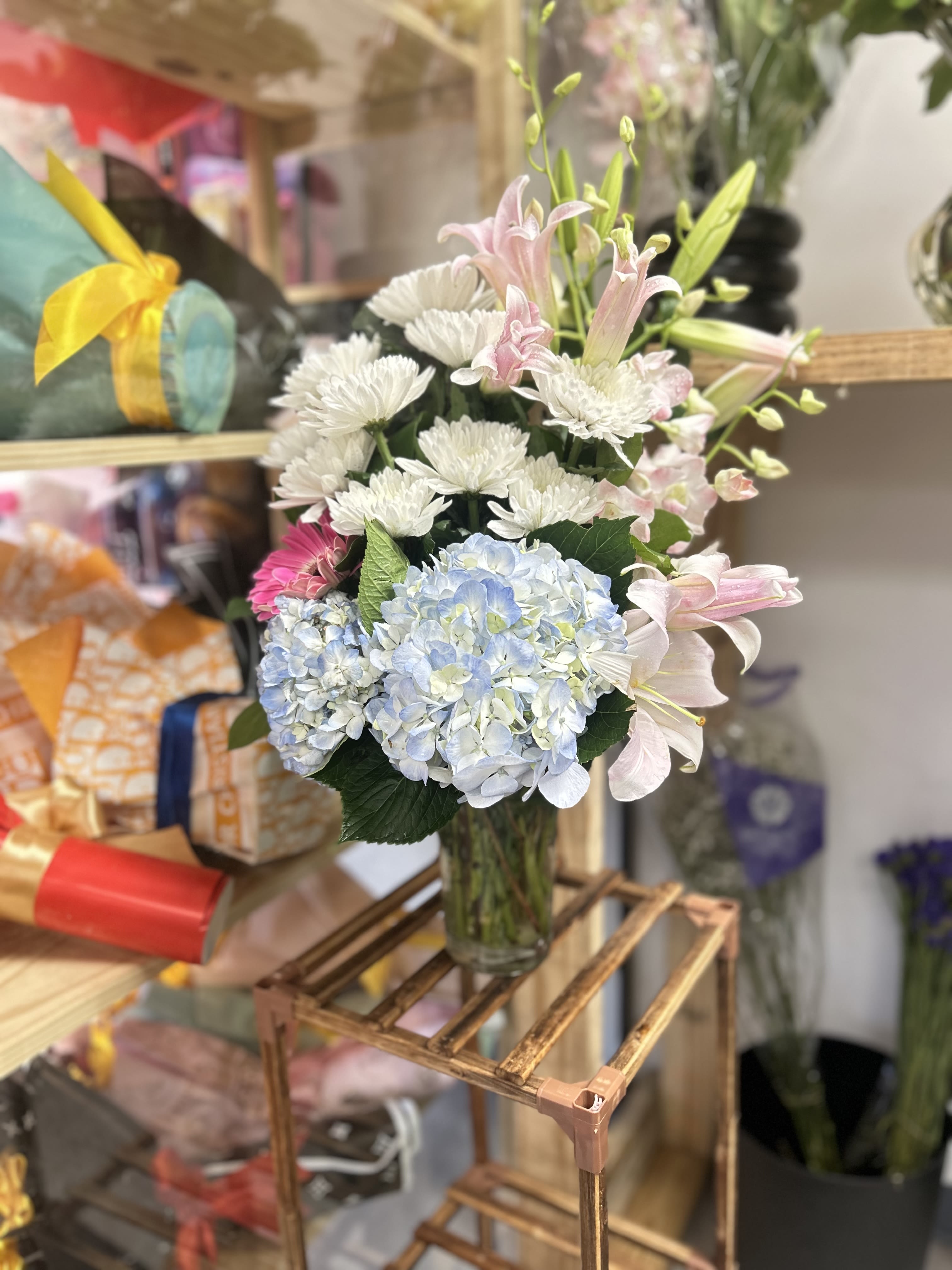 Special and elegant - Special and elegant, enjoy the delicate design of this elegant bouquet, with oriental lilies, hydrangeas, and chrysanthemums.