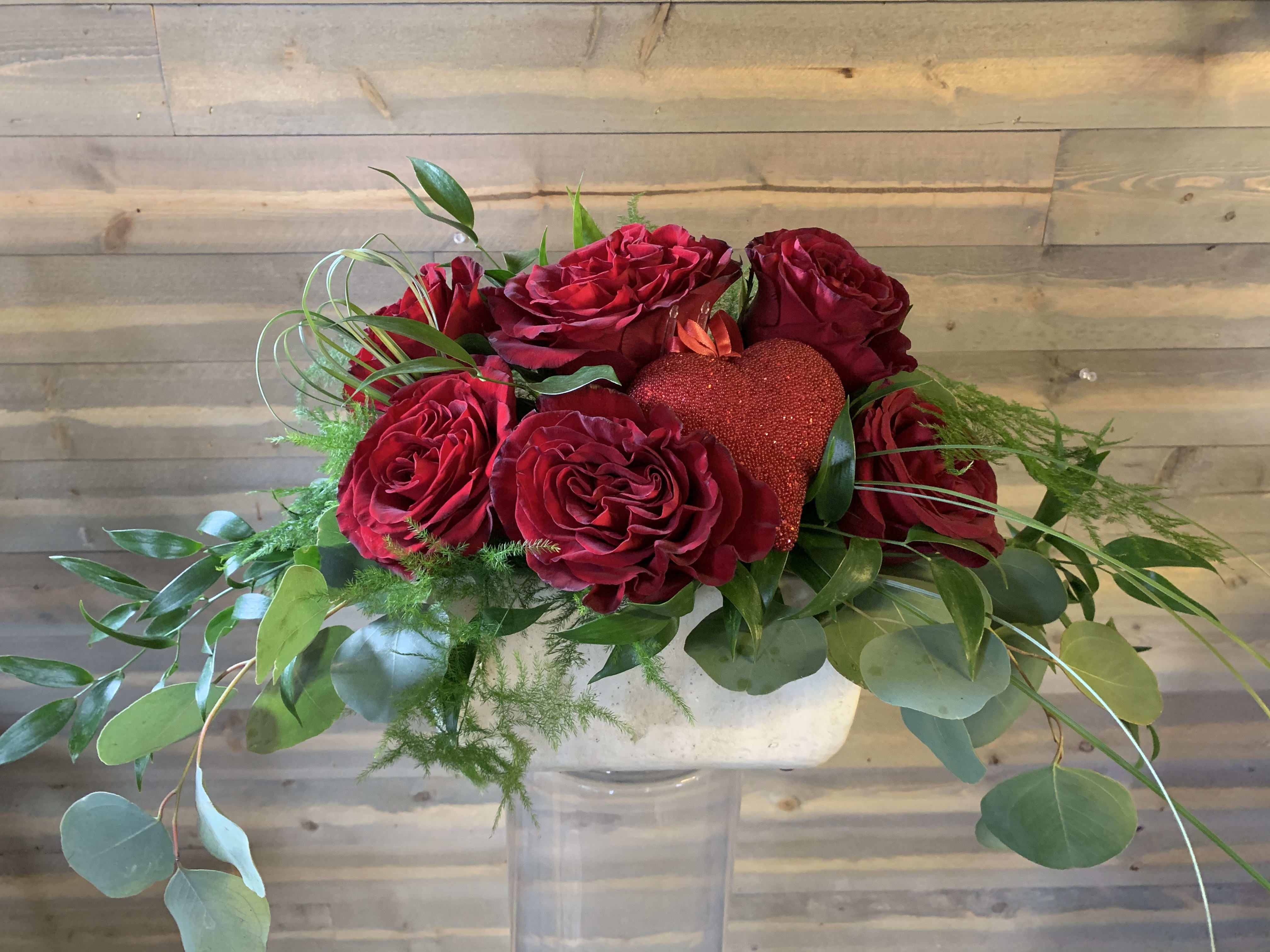 How Deep is your Love ❤️ How Deep is your Love ❤️ - If you appreciate quality over quantity, this arrangement is simple but bold in sentiment . 6 deep red heart roses are accented with deep greens and flowing eucalyptus, and a sparkly heart.