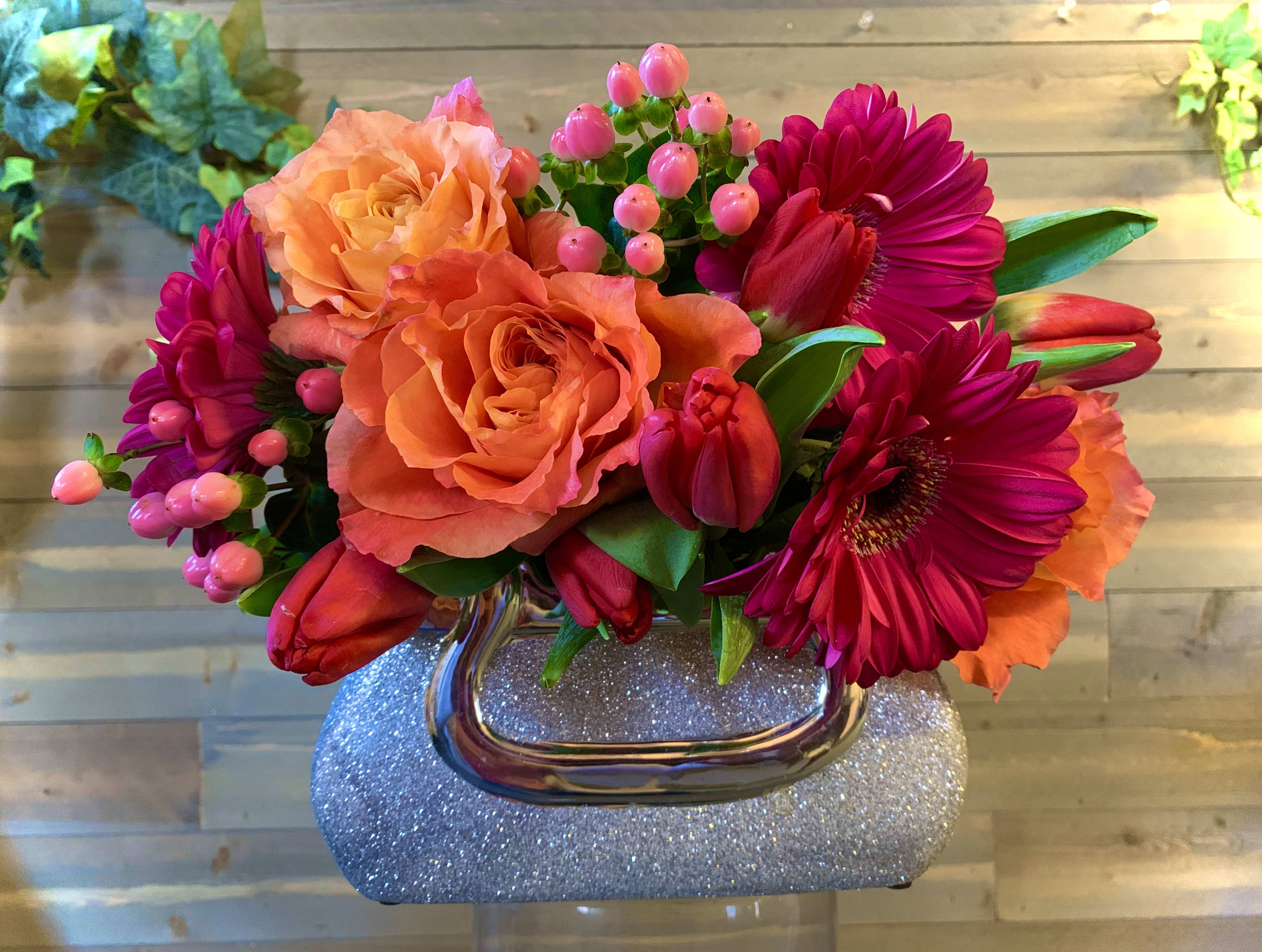 In Hot Purse-uit In Hot Purse-uit - A bedazzled purse vase filled hot colors of spring !