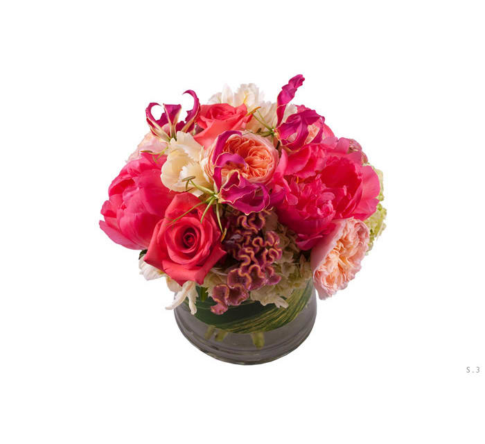 Kim Kim - Fun, vibrant and flirty this arrangement is composed with tones of bright pink and an array of garden roses, peony and coxcomb.