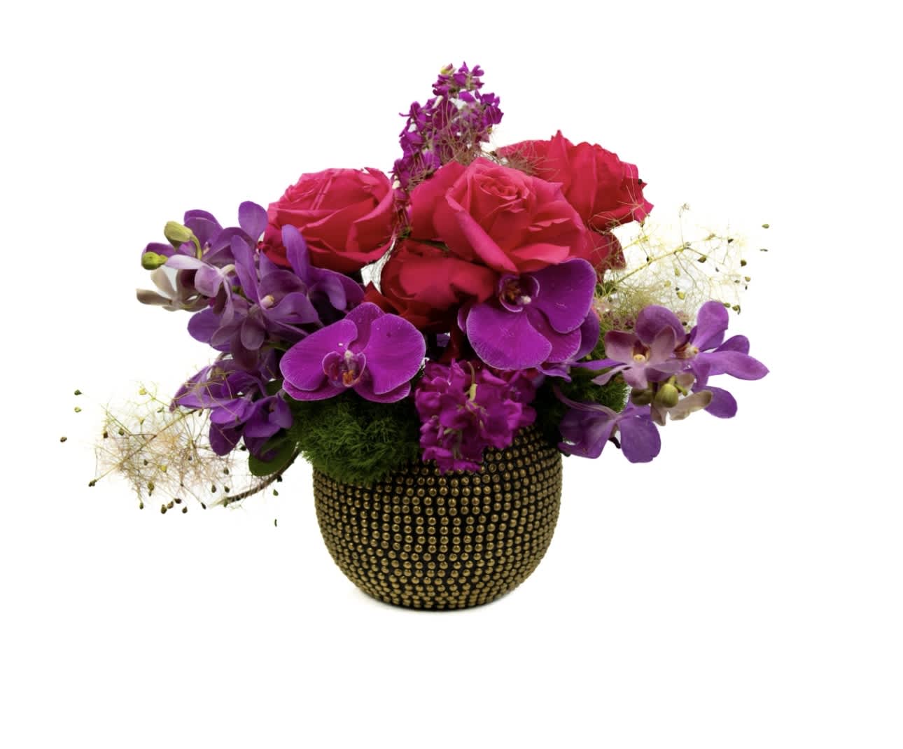 Nina - A low styled arrangement with exquisite orchids paired with complementary florals to deliver a look and feel of magic that is unmatched.
