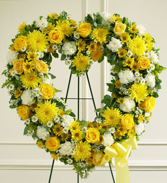 Always Remember Floral Heart Tribute - Yellow and White  - Product ID: 91237   Convey your deepest condolences and undying love with this beautiful arrangement. Yellow and white flowers such as roses, cremones, carnations and more Open heart with oasis in mache, tied to the wire easel with satin ribbon Sent directly to the funeral home by family and friends Our florists use only the freshest flowers available so colors and varieties may vary Measures approximately 32&quot;H x 32&quot;L
