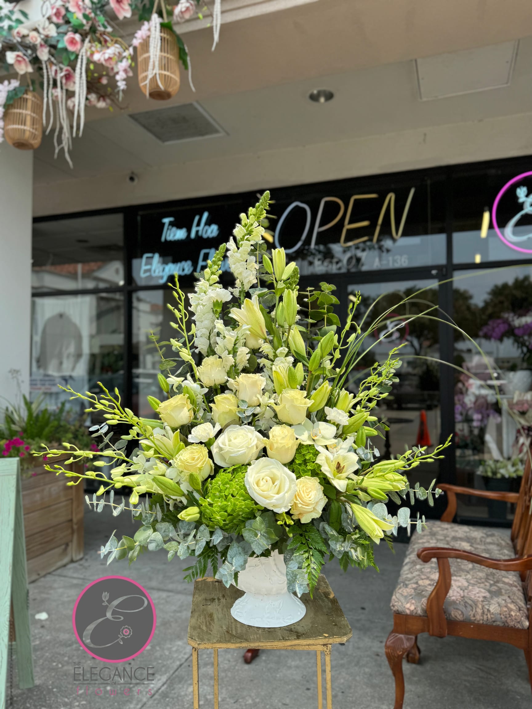 Pedestal Arrangement #1 Pedestal Arrangement #1 - A sympathy arrangement basket offers a heartfelt expression of condolence, featuring a carefully curated selection of serene and elegant blooms. Designed to convey comfort and peace, each basket is thoughtfully arranged with soft hues and gentle fragrances, providing a soothing presence during times of loss.