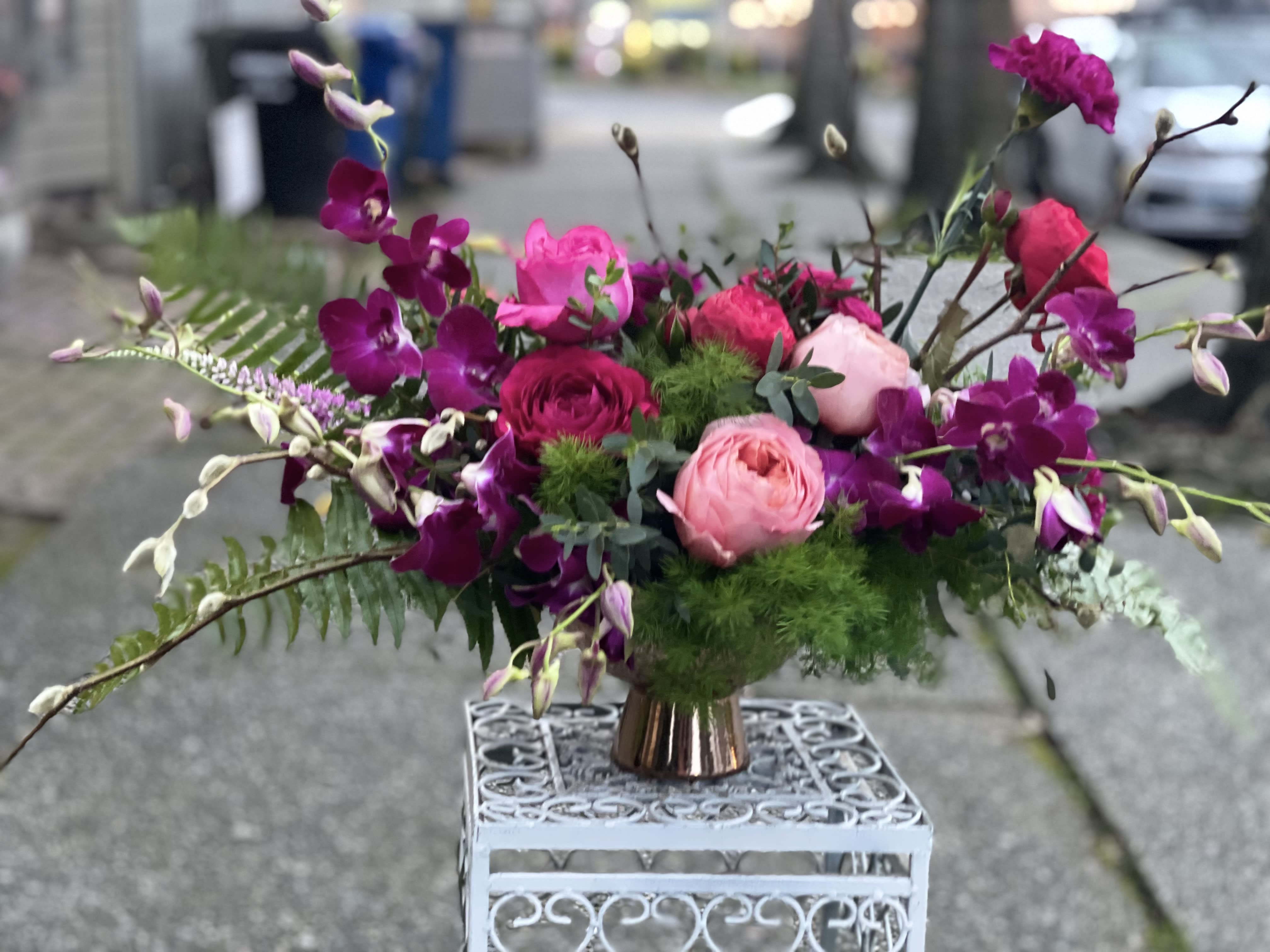 Bohemian Soul  - A bright and bold showpiece, perfect for a big gesture. A selection of luxury blooms including premium Garden roses and orchids, arranged in a keepsake compote vase.   Perfect flowers for birthdays, &quot;get well soon,&quot; romantic gestures, and &quot;Thank you.&quot; Also a beautiful wedding palette.  Available for delivery in Seattle, Bellevue, Shoreline, and surrounding areas. Available for delivery in all neighborhoods in Seattle including Magnolia, Ballard, Fremont, Downtown, Queen Anne, Crown Hill, U District, West Seattle, International District, Capitol Hill, Pioneer Square, Beacon Hill, Columbia City, Georgetown, etc.  