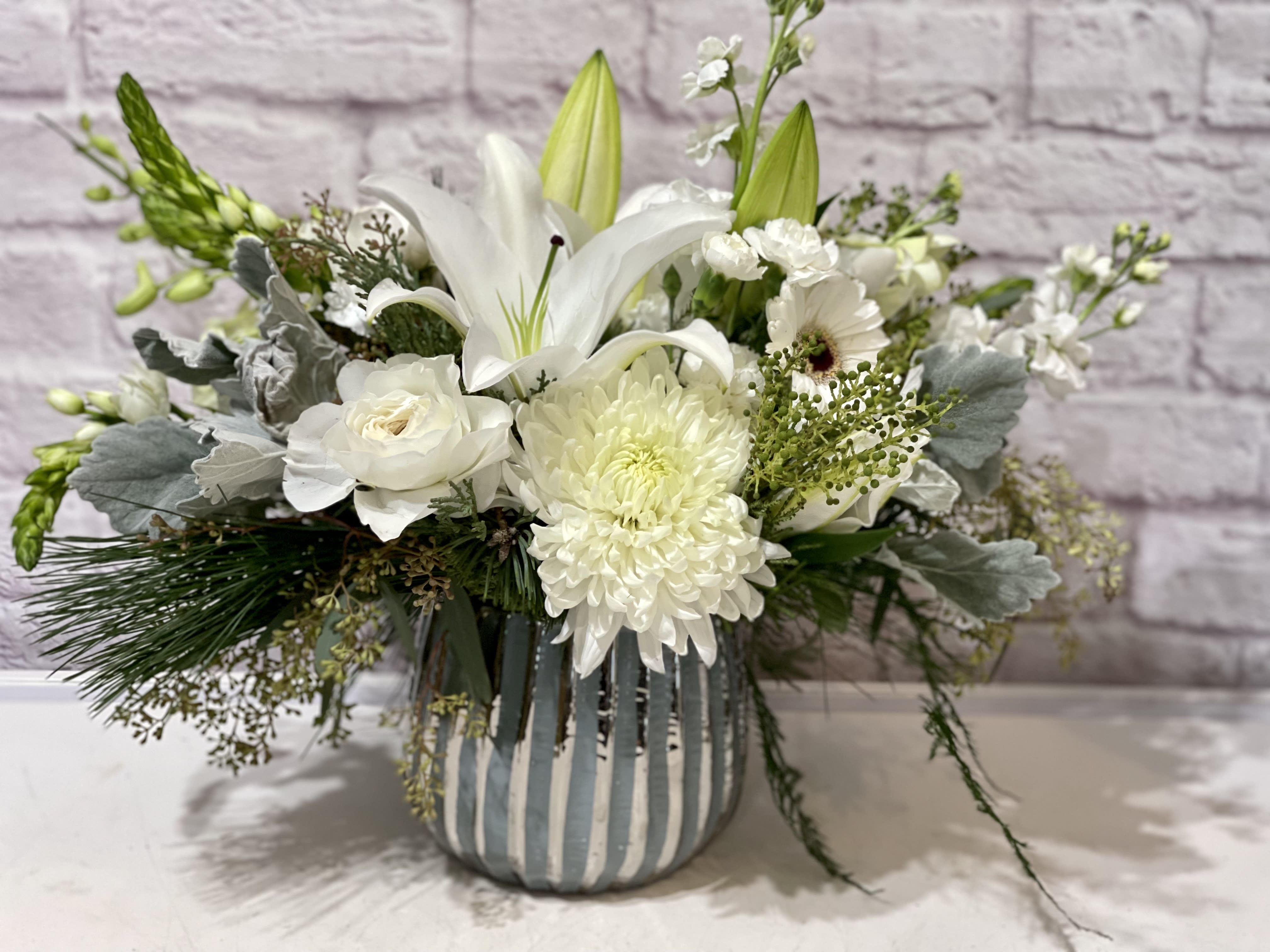 Eternal Grace Eternal Grace - A modern design with a classic color palette, this arrangement is a mix of elegance and excitement in a beautiful high quality vase, featuring all white flowers. Perfect flowers for birthdays, "get well soon," new baby, sympathy, congratulations, romantic gestures, and "Thank you." Available for delivery in Seattle, Bellevue, Shoreline, and surrounding areas. Available for delivery in all neighborhoods in Seattle including Magnolia, Ballard, Fremont, Downtown, Queen Anne, Crown Hill, U District, West Seattle, International District, Capitol Hill, Pioneer Square, Beacon Hill, Columbia City, Georgetown, etc.