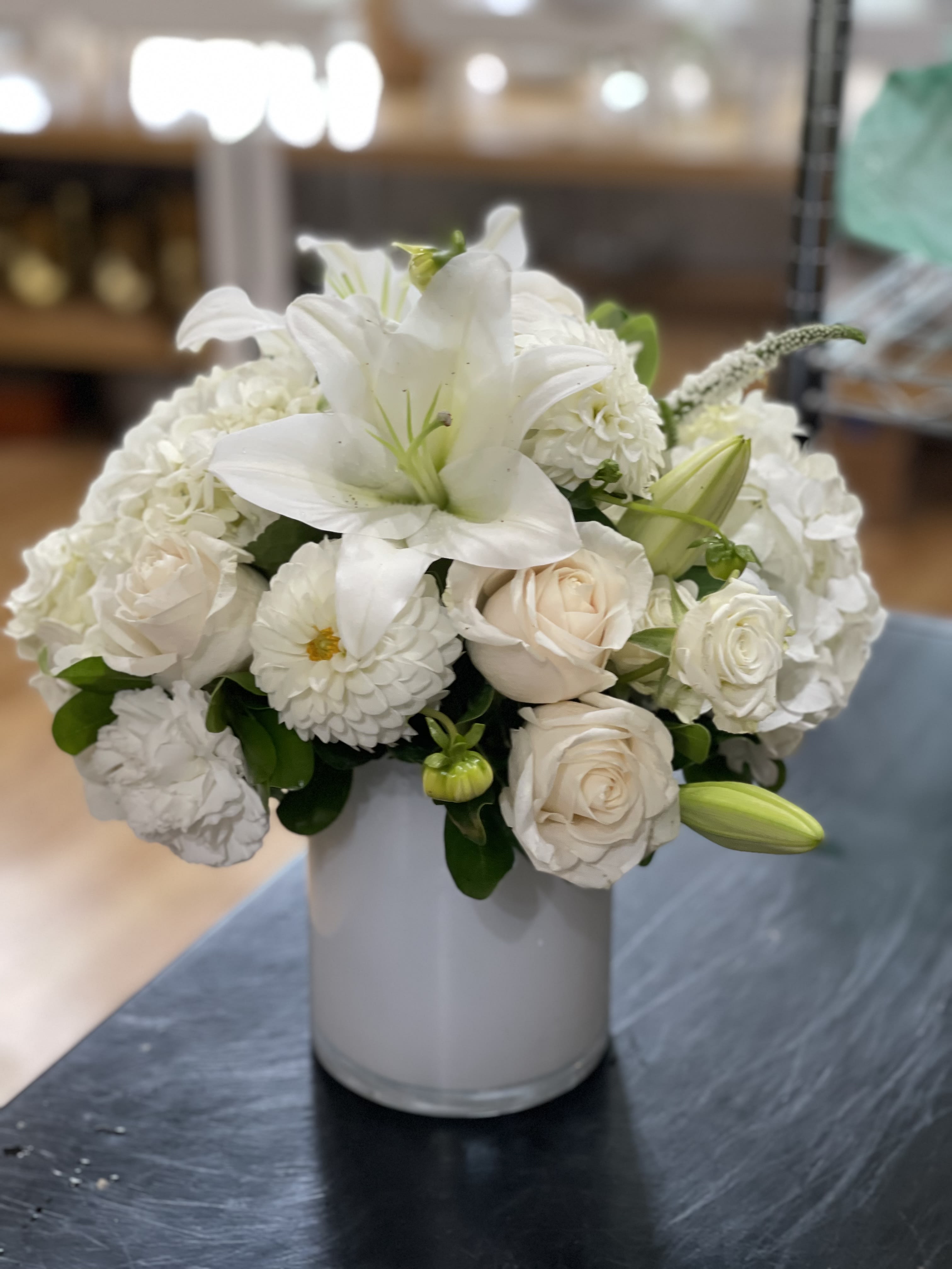 Heavenly  - Classic, elegant, all white. Divinely crisp, this chic arrangement includes white roses, lilies, hydrangeas and lisianthus.   Perfect flowers for birthdays, &quot;get well soon,&quot; new baby, sympathy, congratulations, romantic gestures, and &quot;Thank you.&quot; Also a beautiful wedding palette.  Available for delivery in Seattle, Bellevue, Shoreline, and surrounding areas. Available for delivery in all neighborhoods in Seattle including Magnolia, Ballard, Fremont, Downtown, Queen Anne, Crown Hill, U District, West Seattle, International District, Capitol Hill, Pioneer Square, Beacon Hill, Columbia City, Georgetown, etc. 