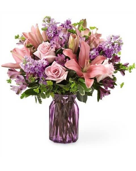 Floral Tenderness - There's something about an alluring mix of pink and purple florals that put a spring in our step! Fresh lilies, roses and stock add an array of beautiful texture in our Floral Tenderness™ Bouquet. Its bursting hues and bright blooms are perfect to celebrate this season. (Lillies,Roses,Stock)
