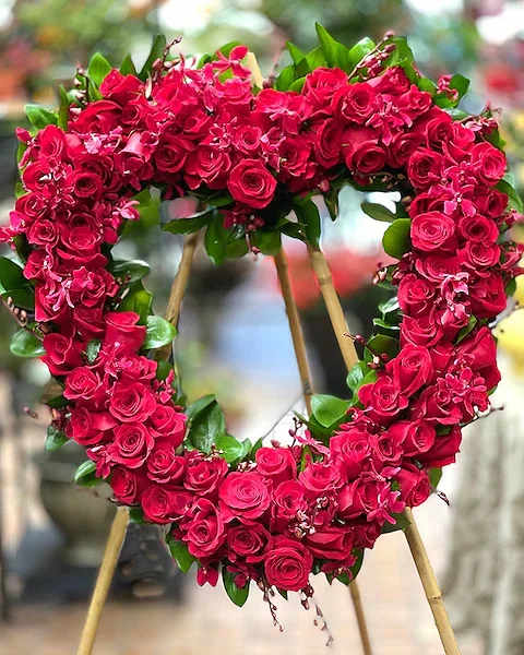 Roses Forever - Floral Heart - Roses are paved into a 24&quot;, 30&quot;, and 36&quot;  heart form and presented on a wire or bamboo easel stand. Perfect to make a statement about the love you feel. NOTE: UNLESS OTHERWISE NOTED, THE HEART WILL BE MADE WITH RED ROSES. OTHER COLORS AVAILABLE. PLACE DESIRED COLOR IN SPECIAL INSTRUCTONS AND ALLOW 48 HOURS FOR CONSTRUCTION.  All prices in USD ($