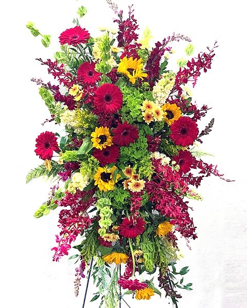 Bold Setting - Bold, bright, seasonal flowers, perfect for a Celebration of Life or graveside service. Note: Please contact the store if other colors are desired, or enter your request in Special Instructions.  All prices in USD ($)