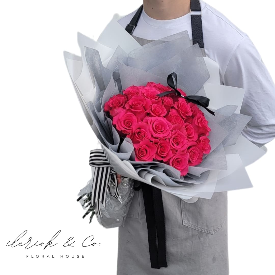 2Dz Round Rose Bouquet - Available in your choice color of roses:  Red Roses Hot Pink Roses Light Pink Roses Purple Roses Yellow Roses White Roses Wrapping paper to compliment your color of choice.  *Standard Size Shown* *Deluxe - 3 dz roses*