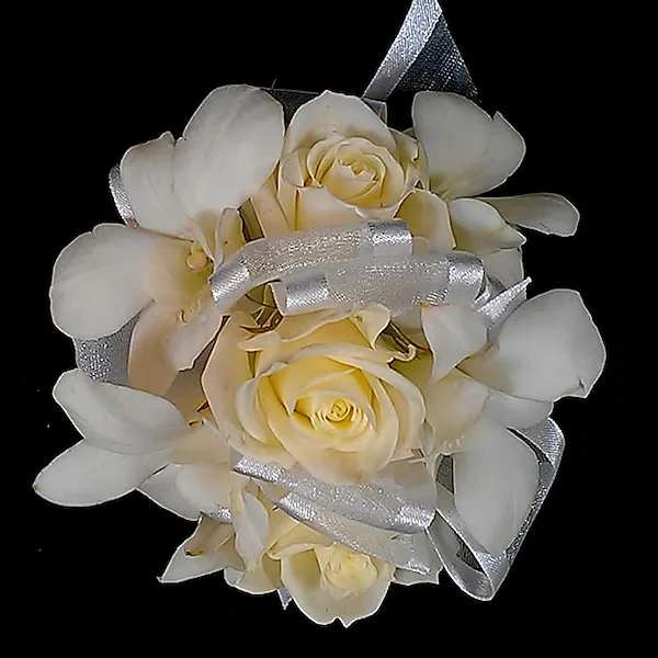 White Rose &amp; Dendrobium Corsage - Elegant white roses and dendrobium orchids with sheer ribbon is the perfect accent to make your evening special. Choose as a pin-on or wrist corsage. NOTE: WRIST CORSAGE BEADED AND CRYSTAL BANDS SOLD SEPARATELY. PLEASE CHOOSE PREFERRED BAND AND ADD TO ORDER. All Boutonnieres and Corsages should be ordered a minimum of 3 - 5 days prior to your event. For needs sooner than that please call the store at 858-454-0146 to ensure availability.  All prices in USD ($)