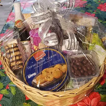Gourmet snack basket Gourmet snack basket - Beautiful medium basket filled with gourmet goodies, chocolate covered almonds, cookies, macroons, a large chocolate bar, mixed nuts, jam and fruit medley.