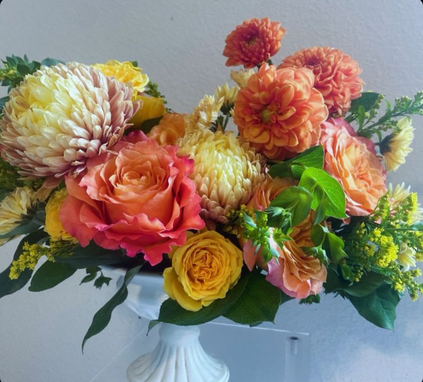California Daze - Give someone the gift of the California sun! This arrangement of dahlias, mums, and Ecuadorian roses is filled to the max in a pedestal compote dish. These flowers are sure to give your loved one that warm embrace feeling of the California sun! 
