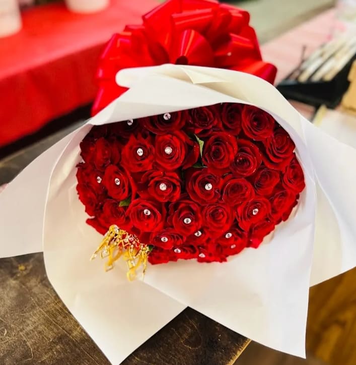 50 Red Rose Bouquet - 50 red roses (wrapped in paper)