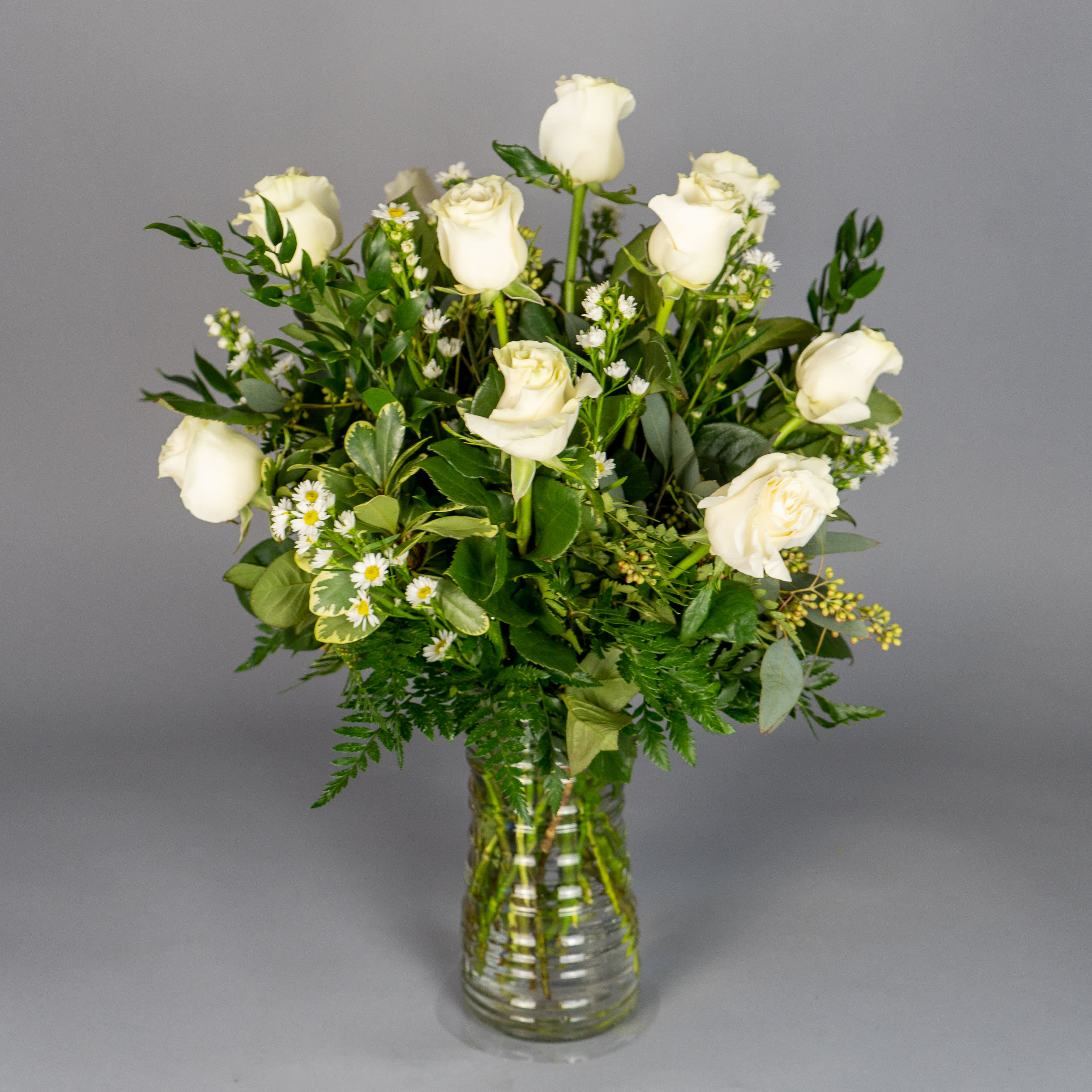 White Rose Elegance White Rose Elegance - Give a gift that shines out in a crowd, whatever the occasion: a fresh, hand-arranged bouquet of fine long-stem white roses. White roses are a sophisticated and beautiful gift that they won't soon forget.