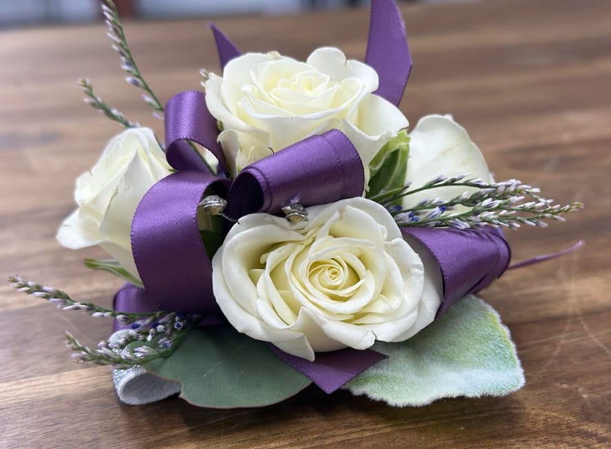 Corsage (purple)  - Great for any occasion.  Prom/Wedding and more  Call or email to change the color of the ribbon of your choice!  