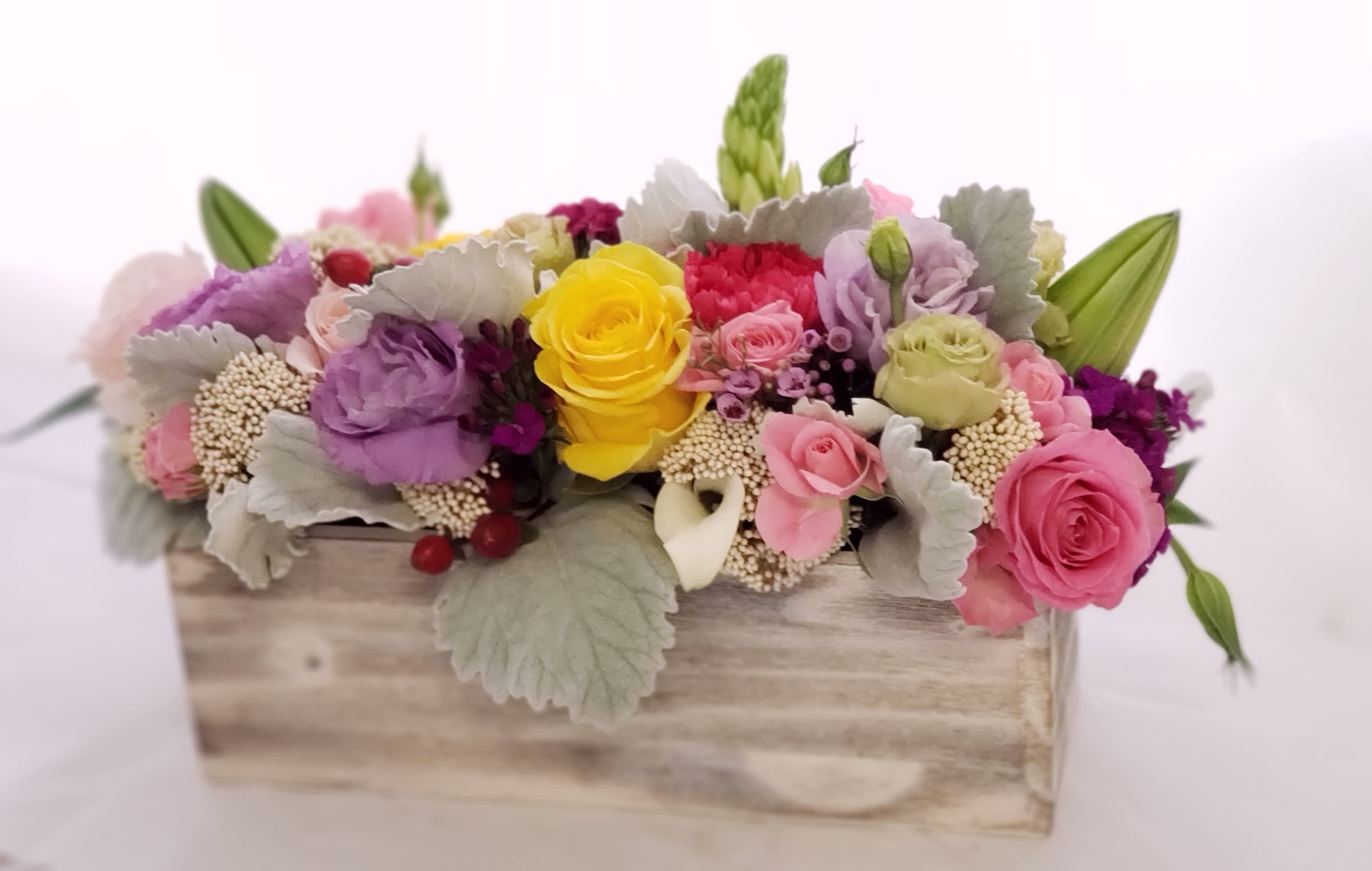 Groovy by BloomNation™ - Keep things fun with this jewel toned flower box! Ranunculus, roses, and lisianthus in a wooden garden box give this arrangement its bright colors and textures to create a beautiful centerpiece or gift.      APPROXIMATE DIMENSIONS 18&quot; W X 10&quot; H